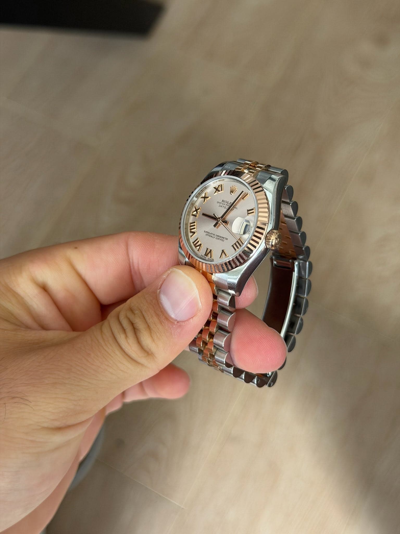 May be an image of wrist watch and text