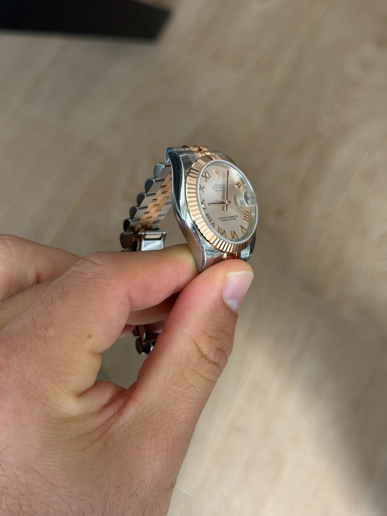 May be an image of wrist watch and text