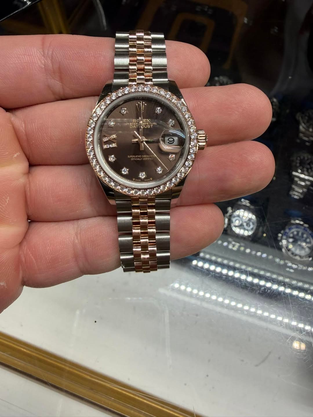 May be an image of wrist watch and text