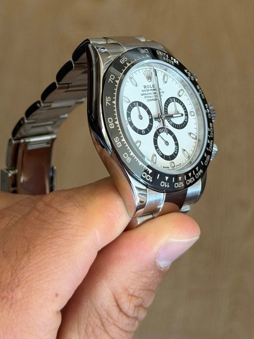 May be an image of wrist watch and text
