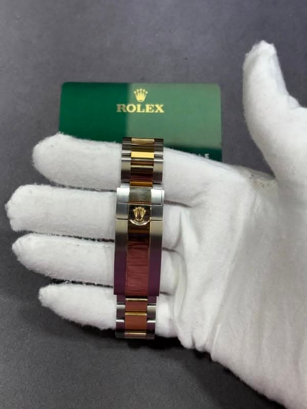 May be an image of wrist watch and text that says 'ROLEX'