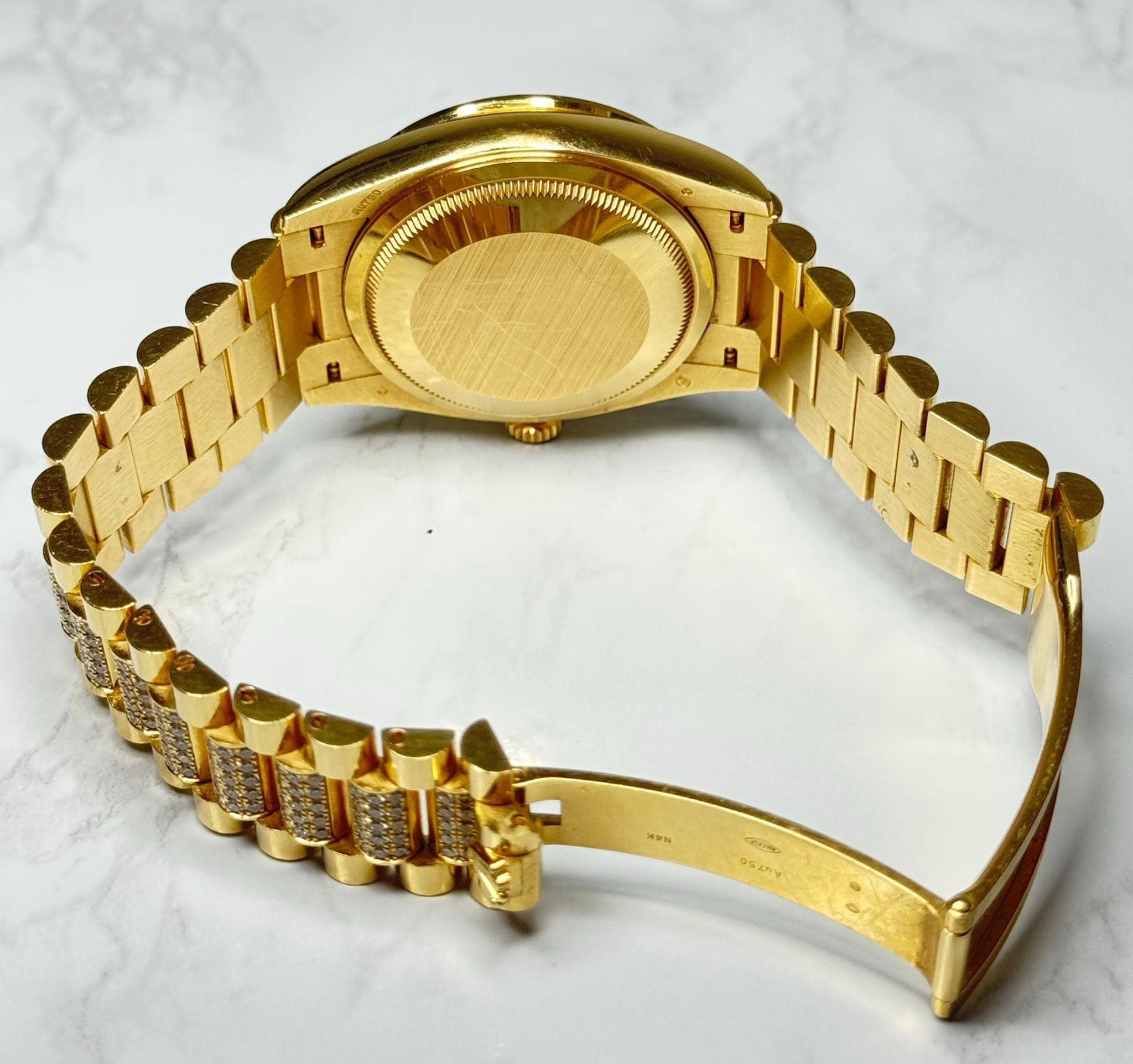 May be an image of wrist watch and text