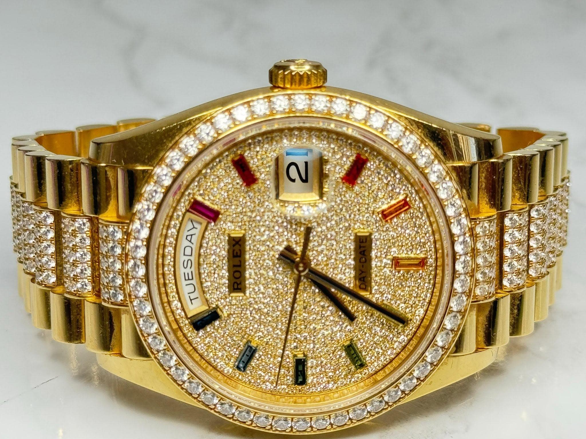 May be an image of wrist watch and text that says '2}ម 2 TUESDAY'