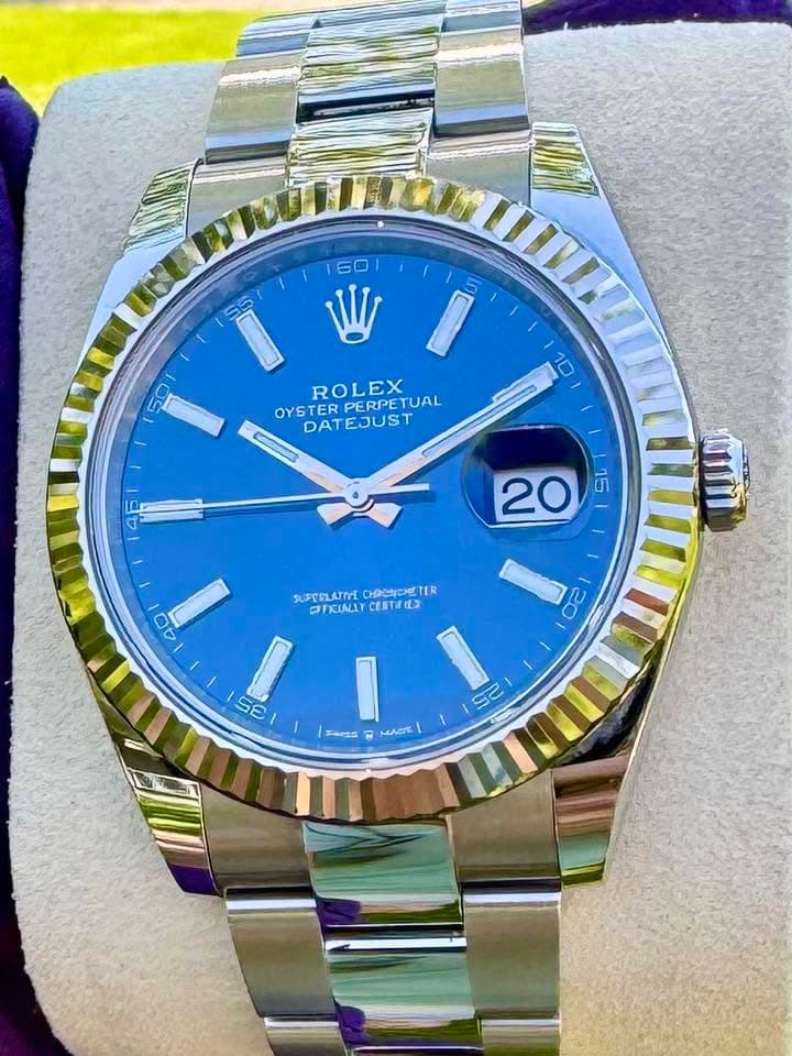 May be an image of wrist watch and text