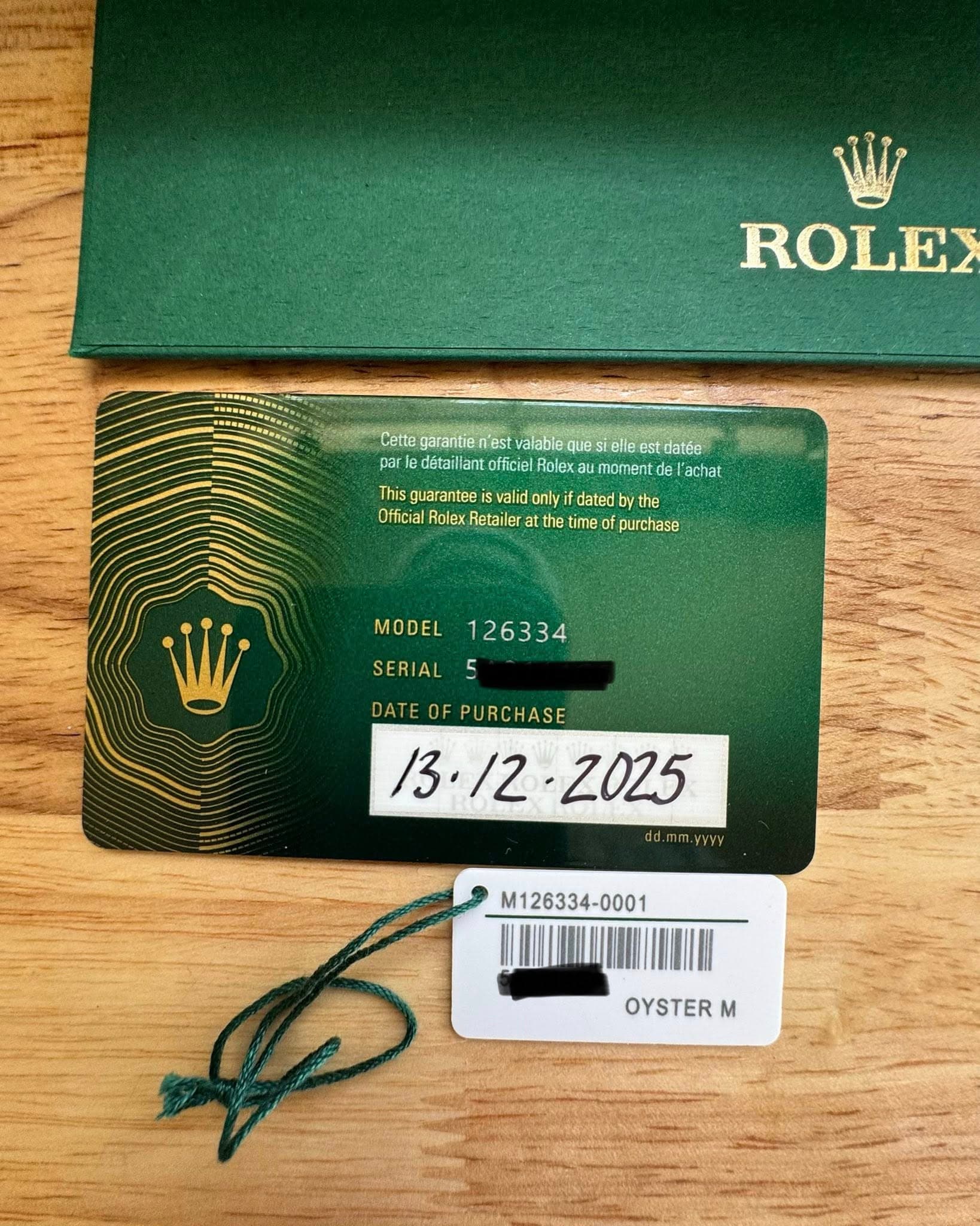 May be an image of wrist watch and text that says 'ROLEX Cette garantien Test valable ques elle st datée par détaillan officiel olex au momen de achat This uarantee valid onlyit…