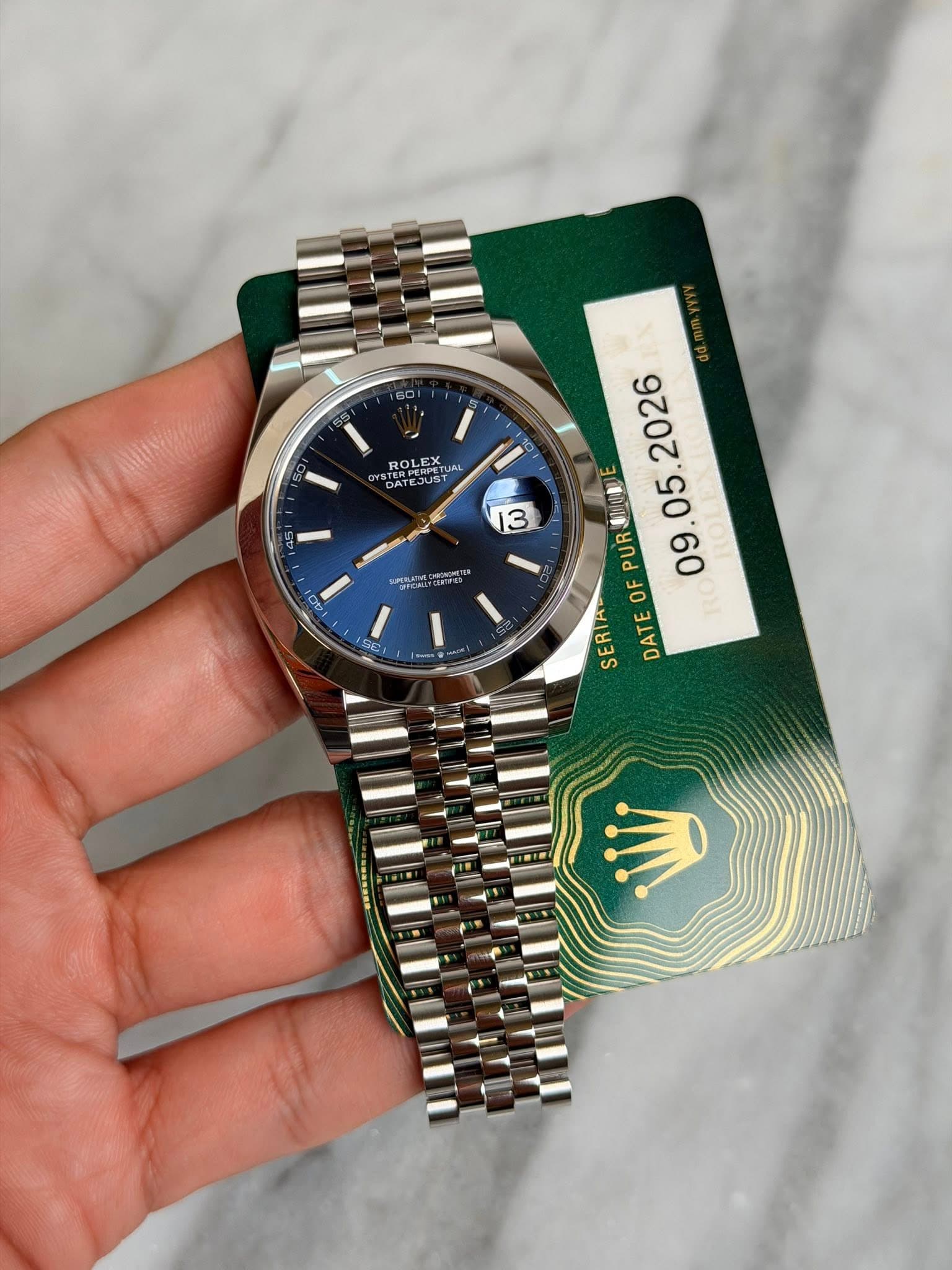 May be an image of wrist watch and text that says '60 ROLEX UAL UAL モ4 AL DATEJUST TERAEST 13 社 40 2026 UR地園 DATEOFPURIDE PURO 05. PUR OF . SERIA DATE ر'