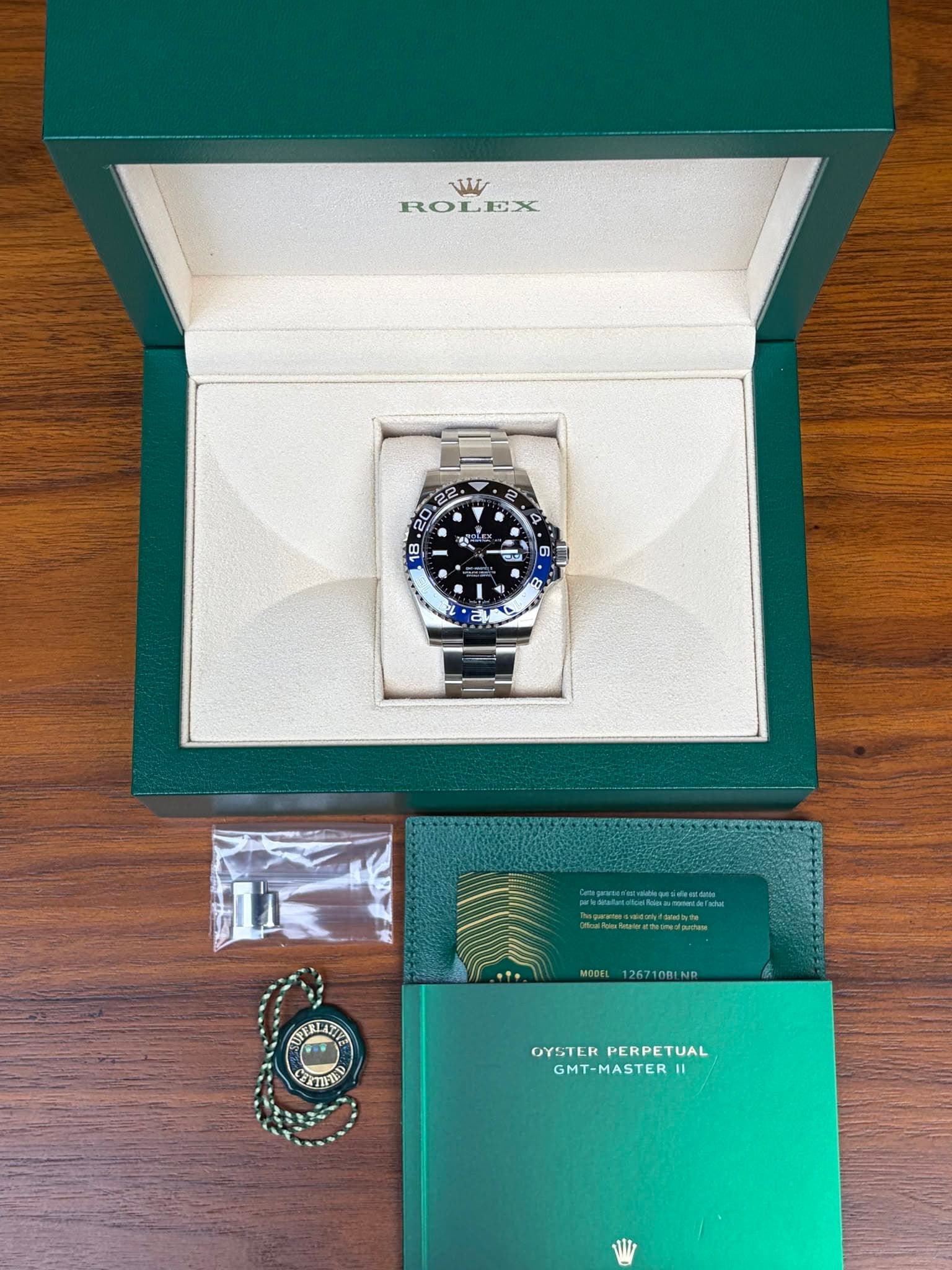 May be an image of wrist watch and text that says 'w ROLEX ቆ0 "0 Y G 2E 18 ជា - E 4 自 NaN .m/ 小時糖 MODEL 126710BLND KAAeИ OYSTEKPERPETUAL OYSTER PERPETUAL GMT-MASTER 11'
