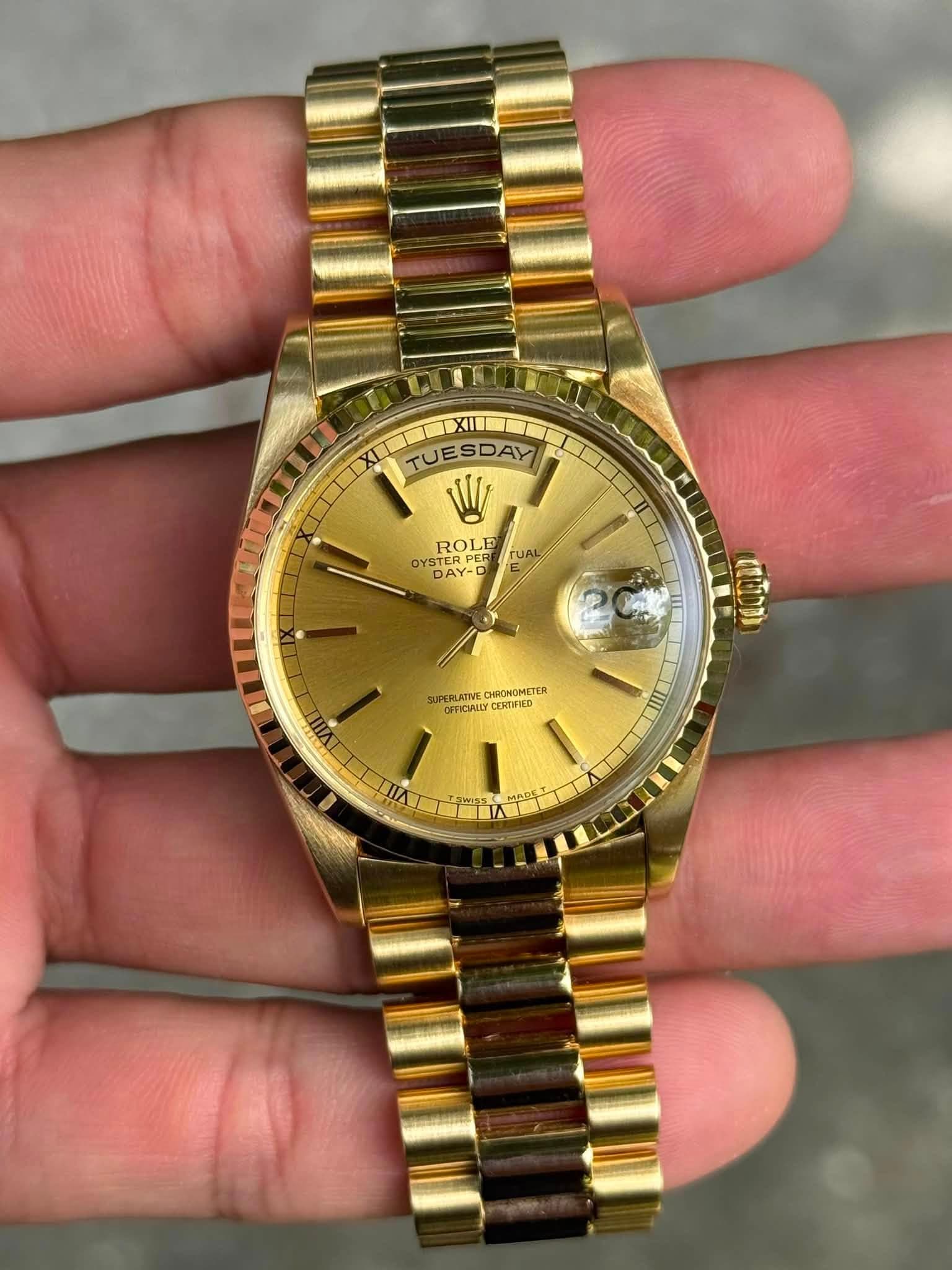 May be an image of wrist watch and text