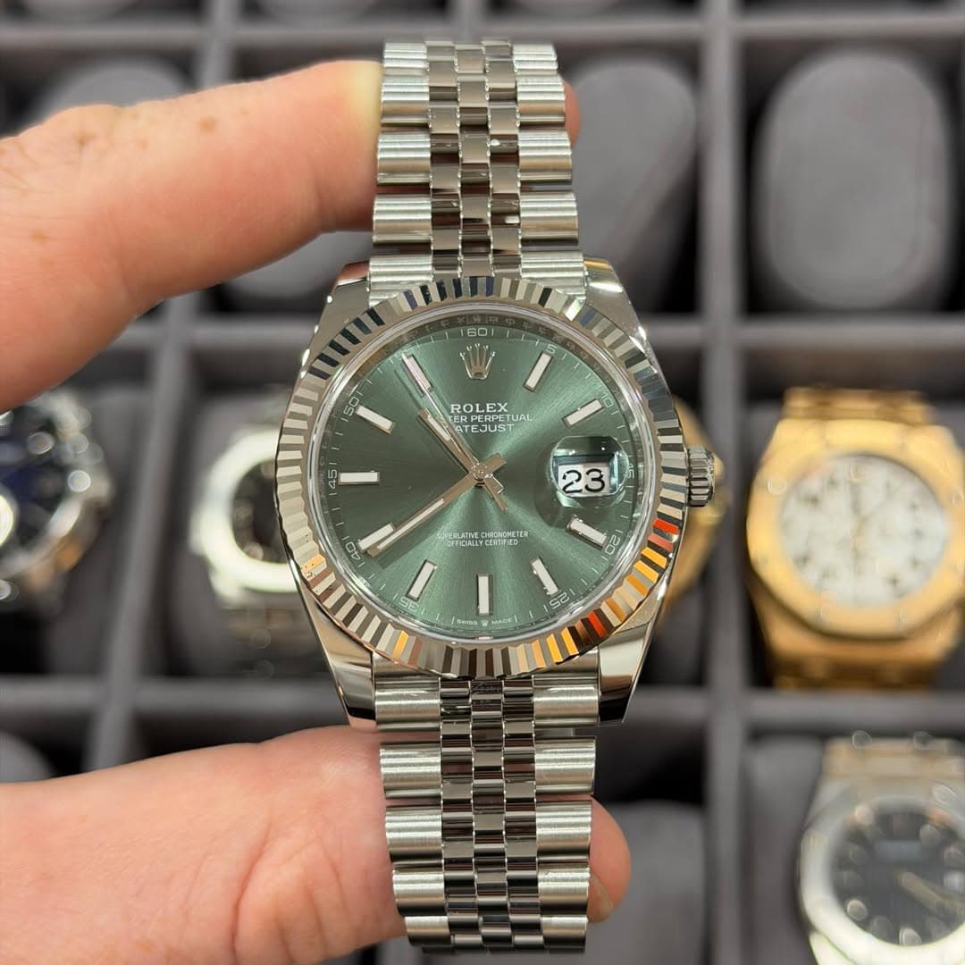 May be an image of wrist watch and text