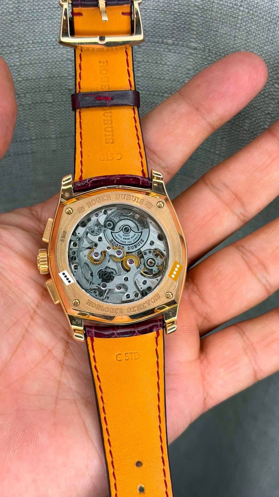 May be an image of wrist watch and text