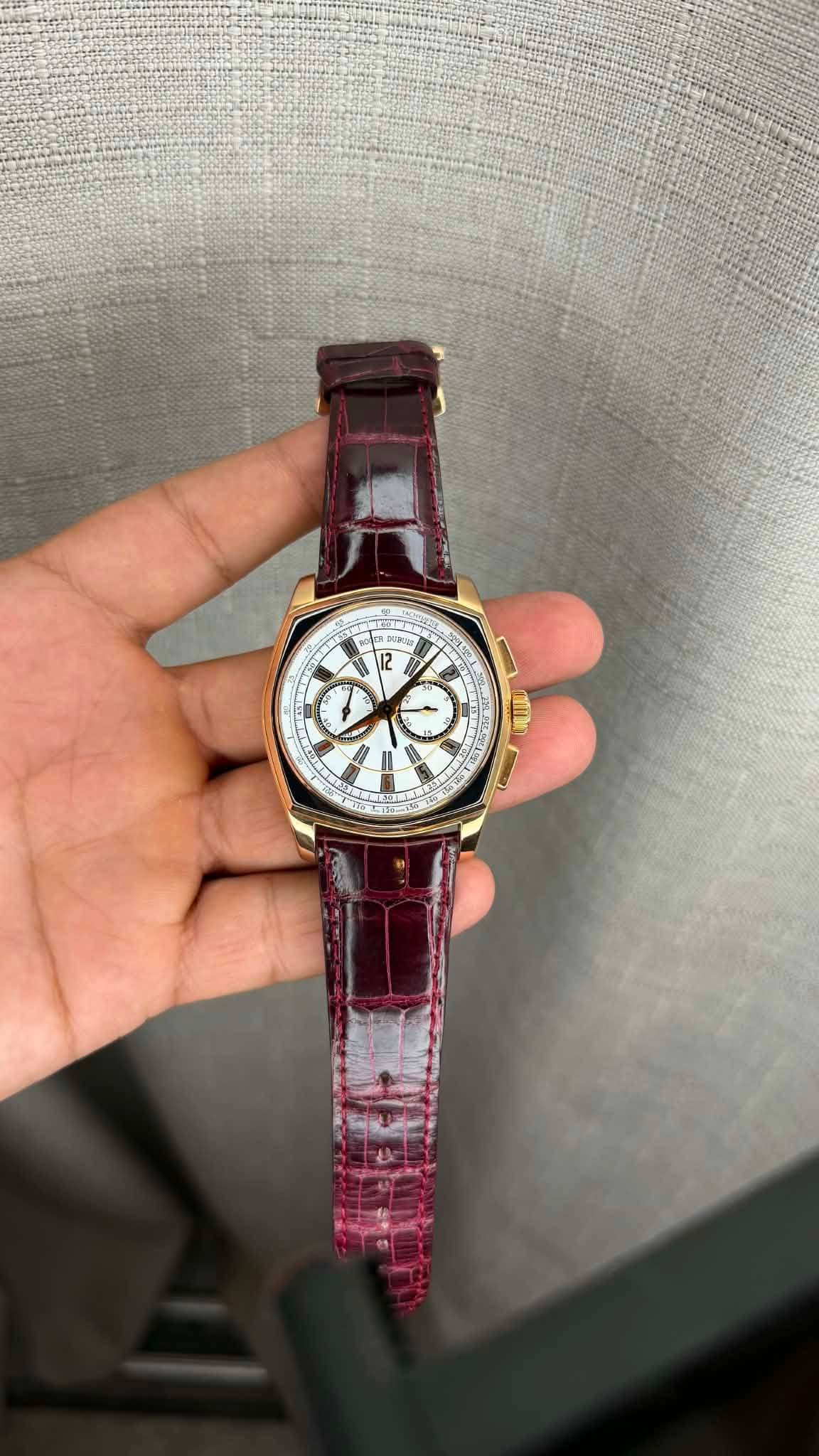 May be an image of wrist watch and text