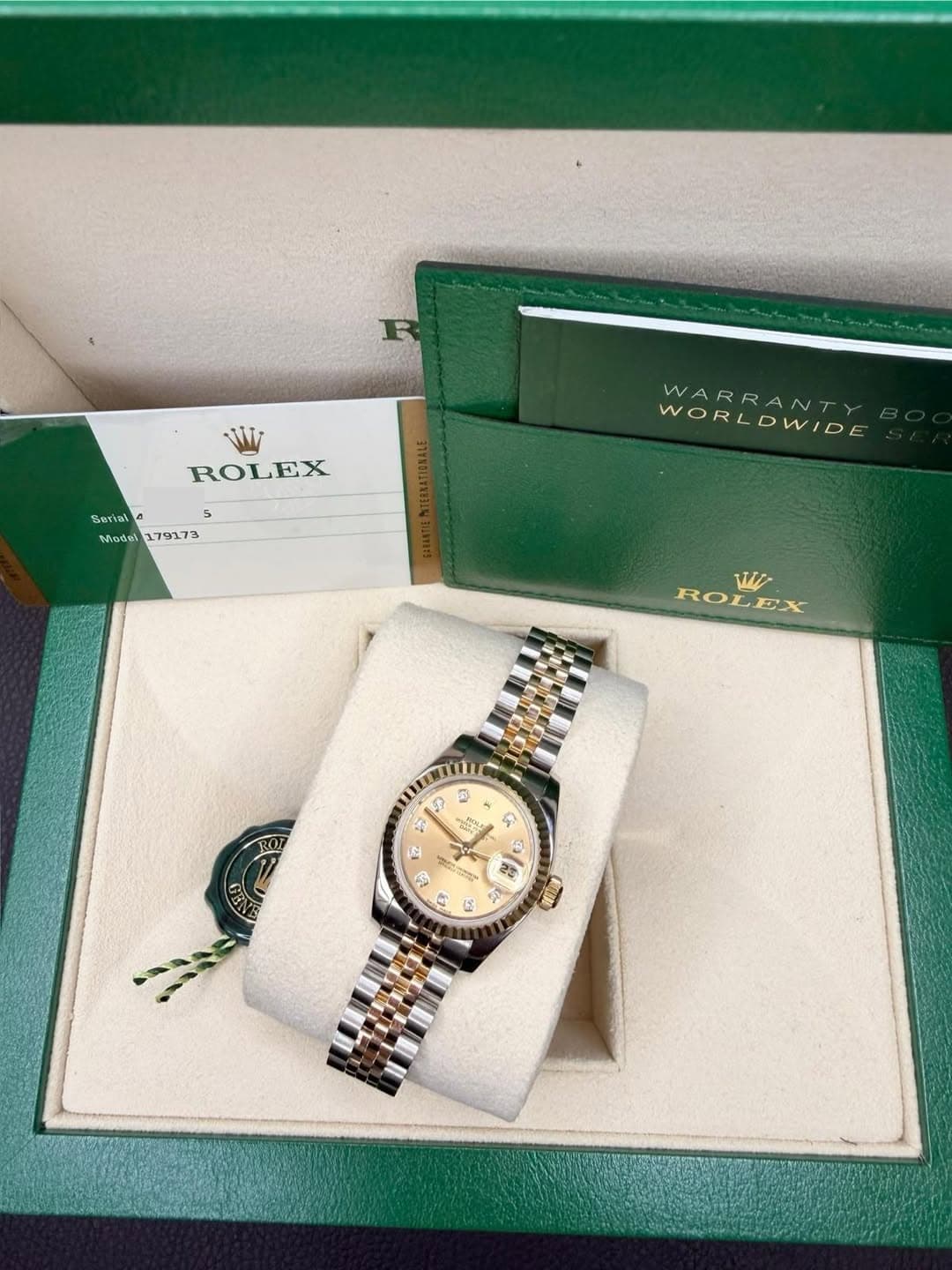 May be an image of wrist watch and text that says 'ROLEX EX 5 5 Sertal Miodel179173 A5 Model 179173 WORLDWIDE WARRANT w ROLEX WI R D 없는 G 0 의 C S 5 2 口'
