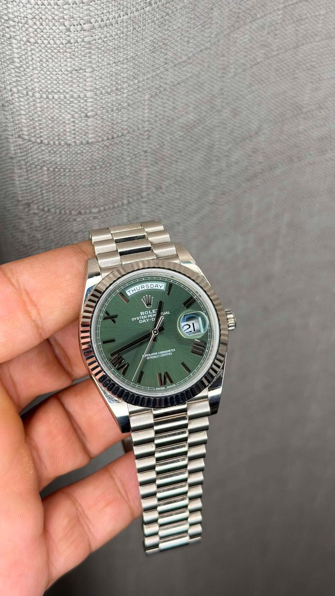 May be an image of wrist watch and text
