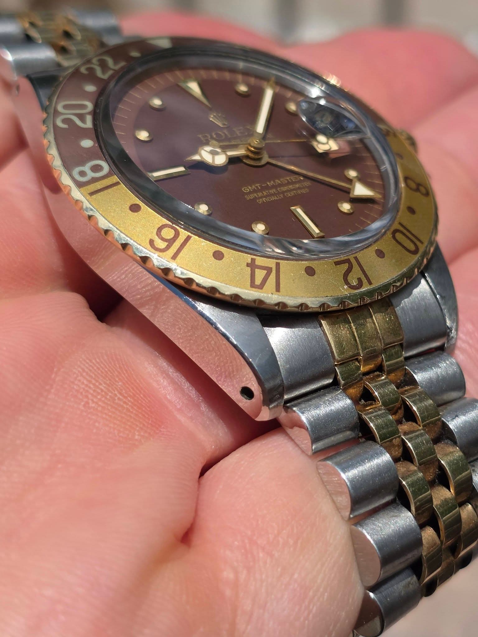 May be an image of wrist watch and text