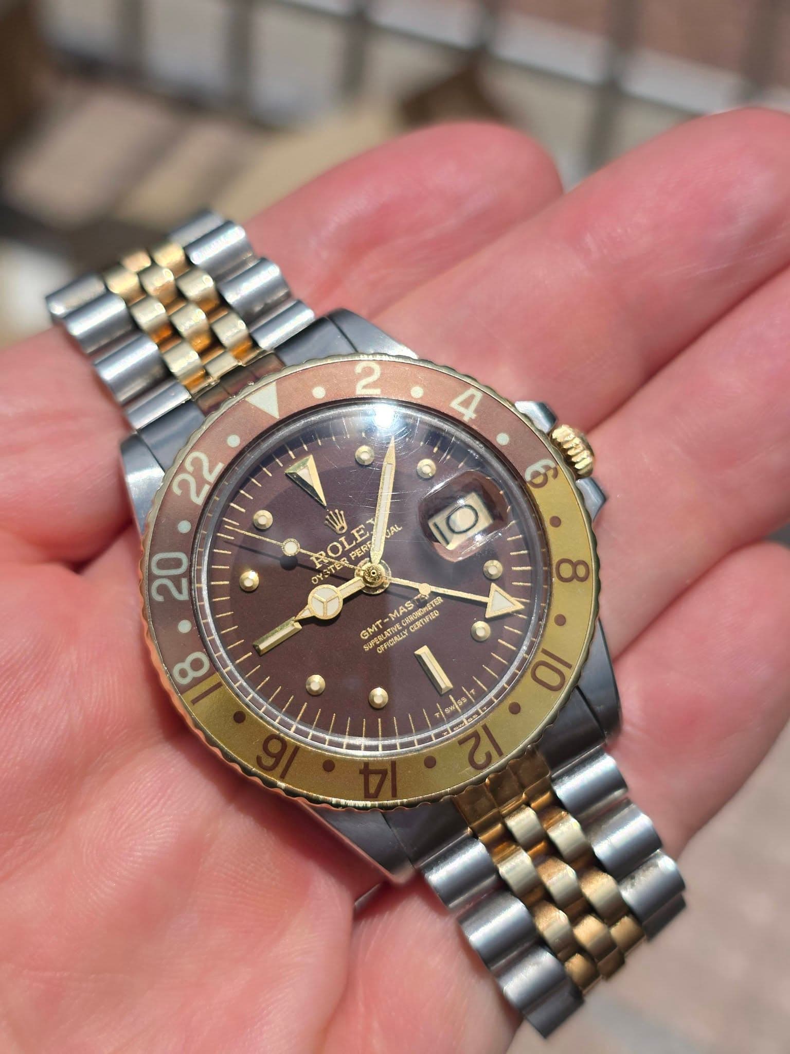 May be an image of wrist watch and text