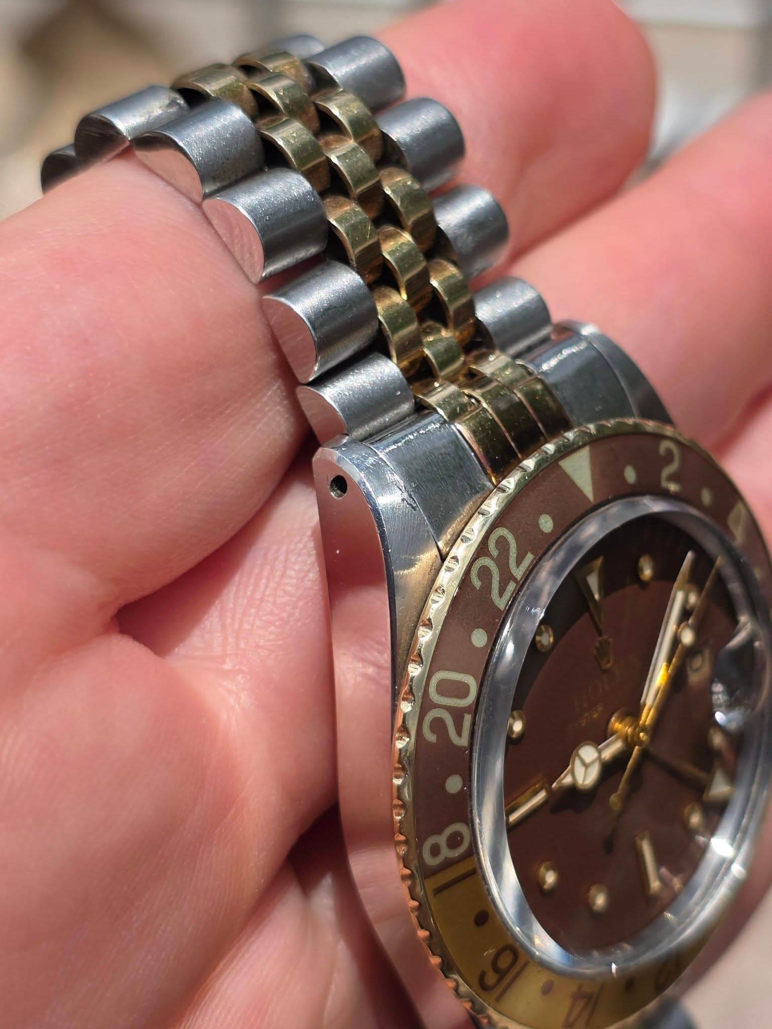 May be an image of wrist watch and text