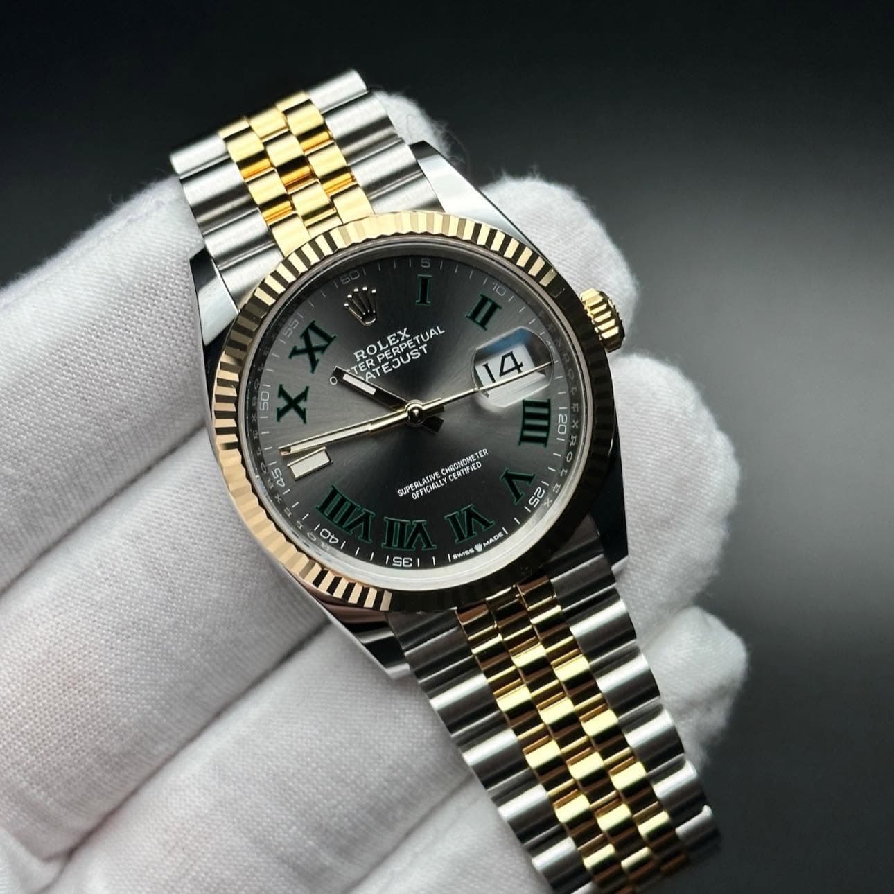 May be an image of wrist watch and text