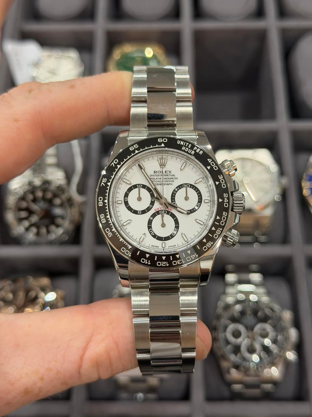 May be an image of wrist watch and text