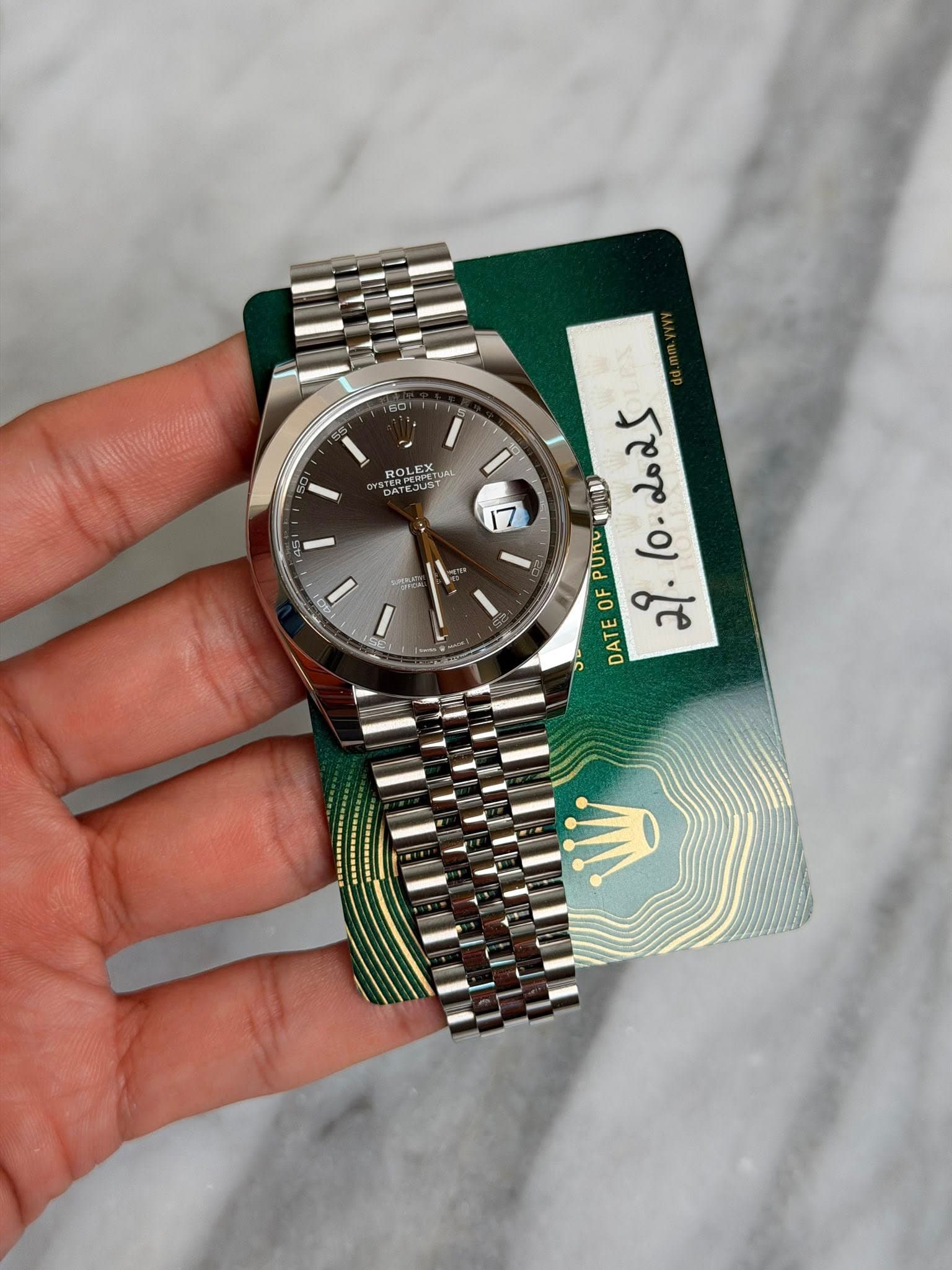 May be an image of wrist watch and text that says 'GD ROL ROLEX LEX ERPEE EJUST 7 Mie We PURC 10-2025 ဆိ.10-2025 lo. OF 2 DATE'
