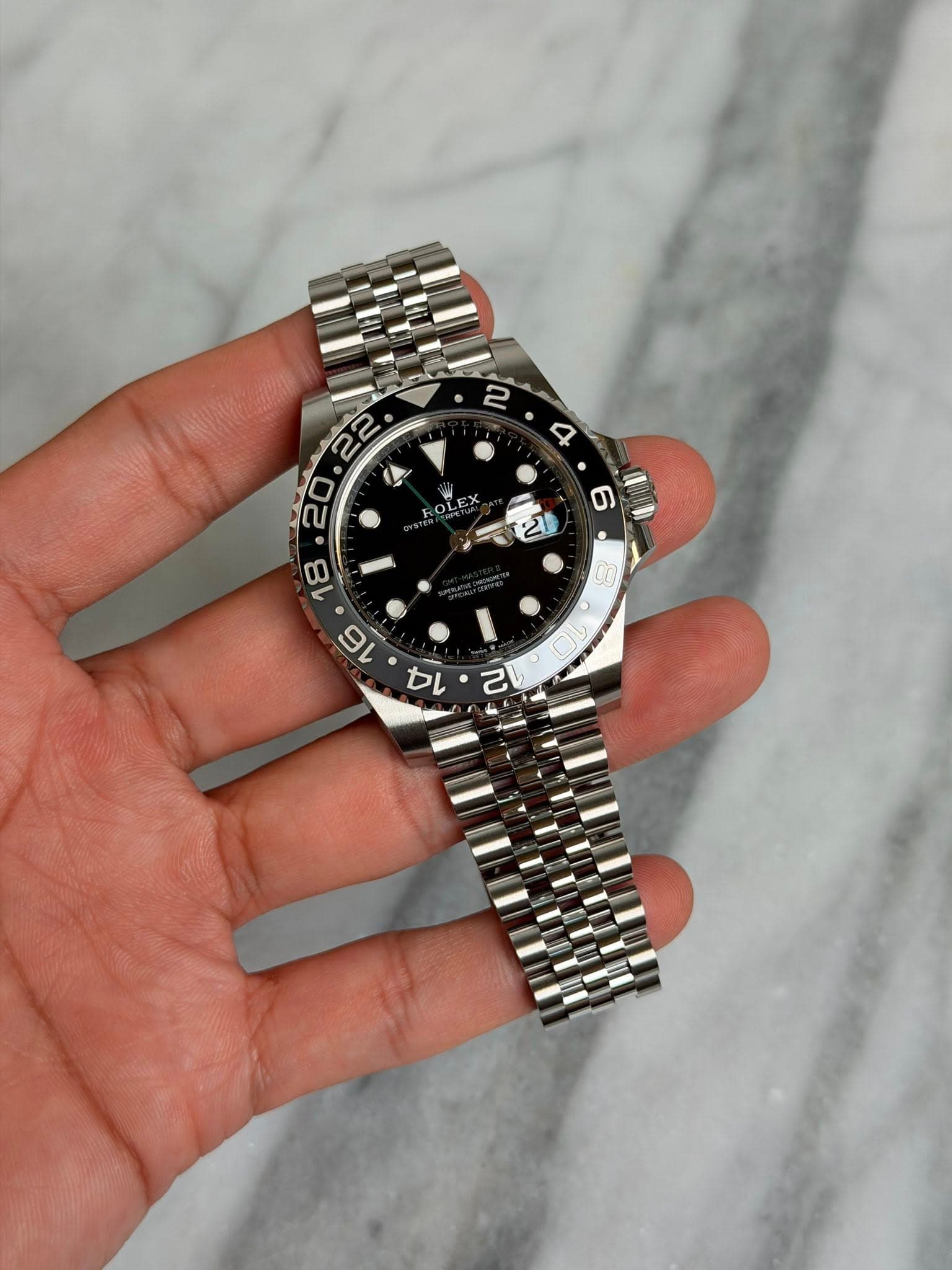 May be an image of wrist watch and text