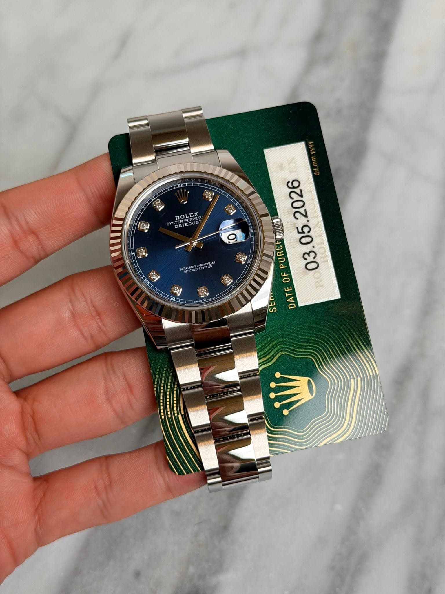 May be an image of wrist watch and text that says 'XC 2 ROLEX 9 국니 eл . PURCI 03. OF SEN DATE ン'