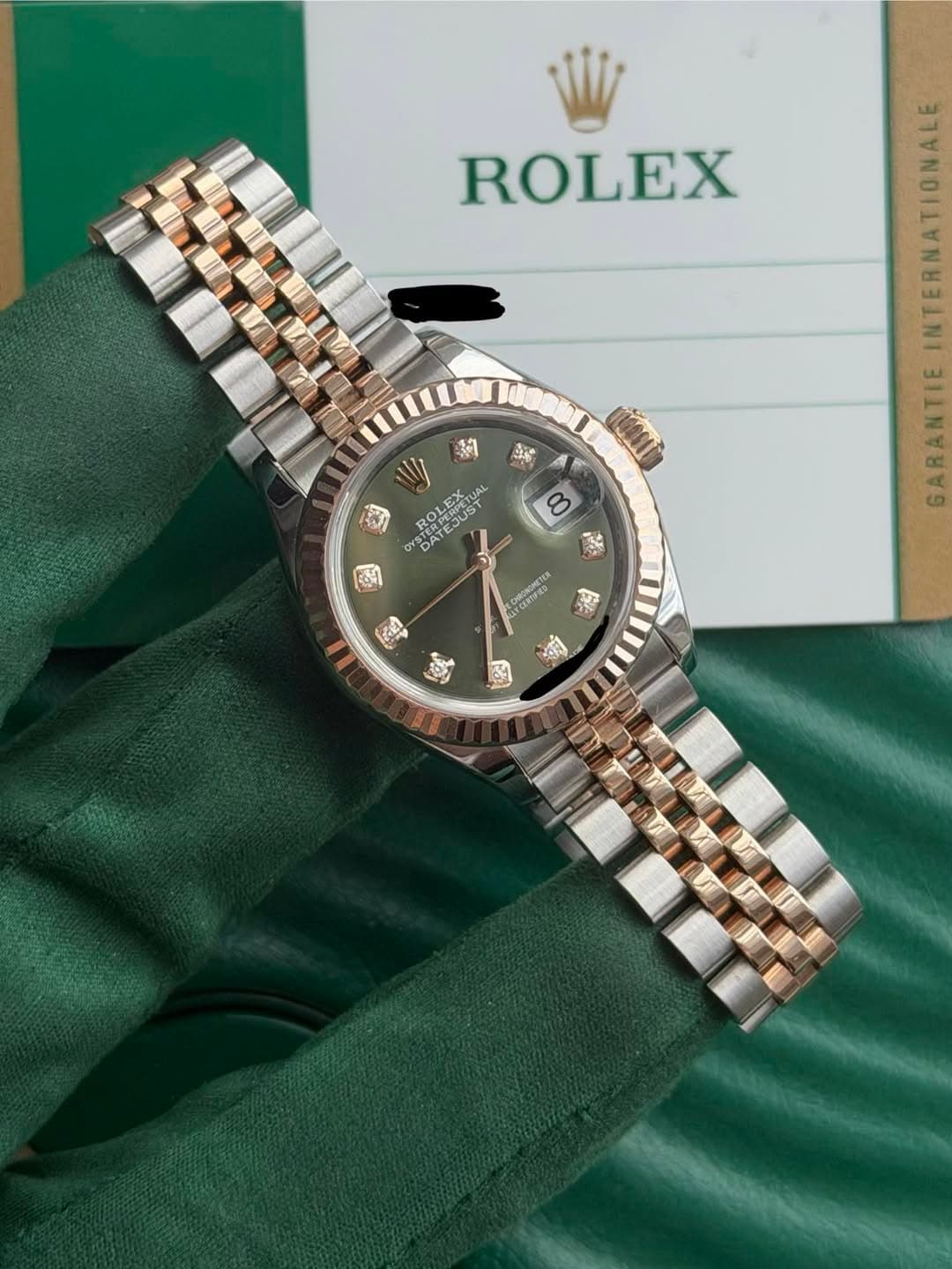 May be an image of wrist watch and text