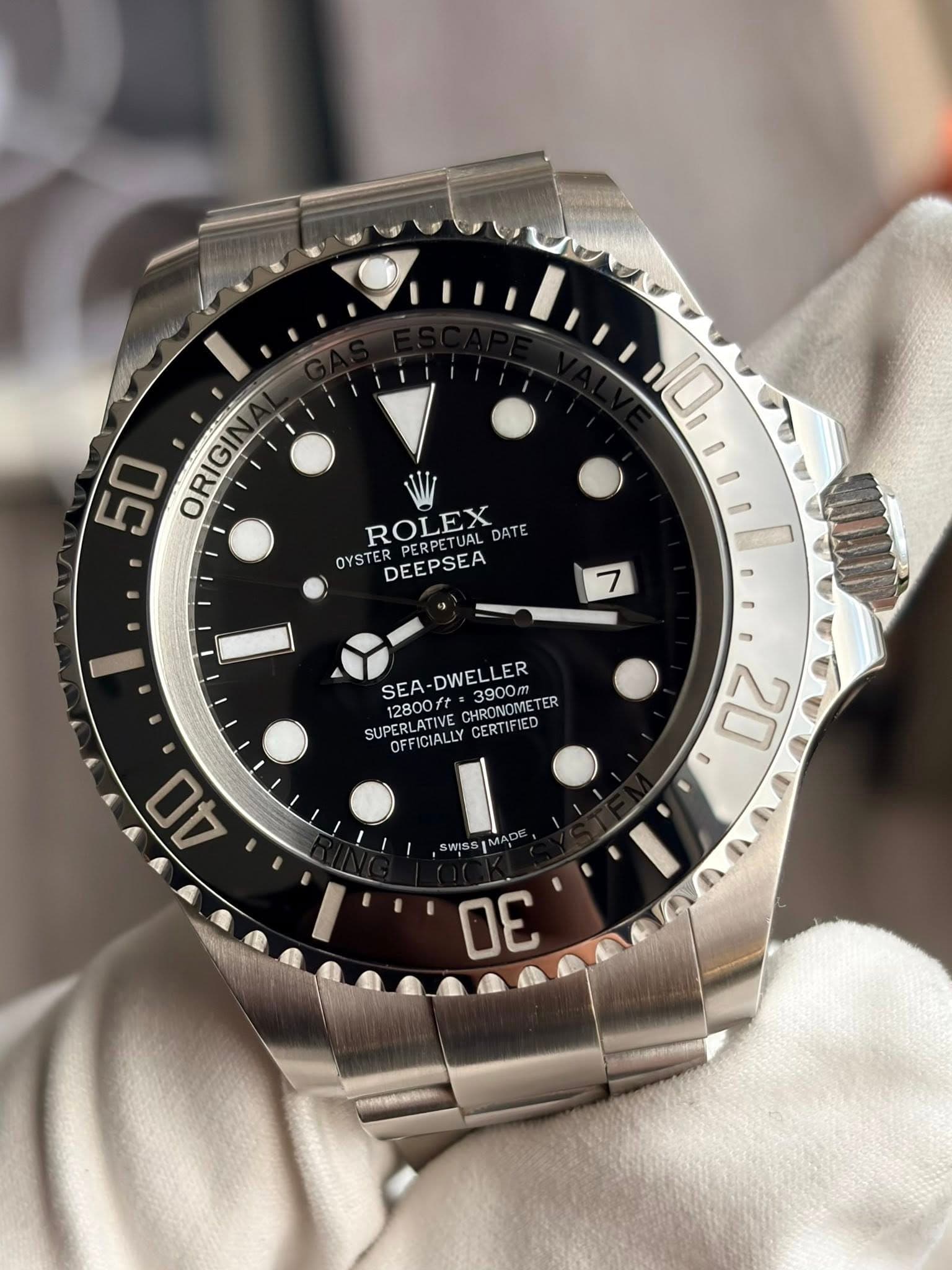 May be an image of wrist watch and text that says '50 ORIGII 10 ROLEX RPERPETUAL_DAT DATE OYSTE DEEPSEA 7 SEA-DWELLER SEA 12800ft 12800/ 3900m DWELLER 3900m CHRONOMETER TER SU…