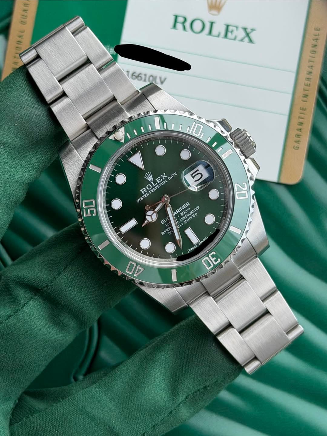 May be an image of wrist watch and text that says 'BUAR ATIONAL ROLEX 16610LV 10 NTERNATIONALE GARANTIE LEX EX TUAL DATE R てく PERPE PERP OYSTE OY STER TER 5 50 20 ARINER x300m.…