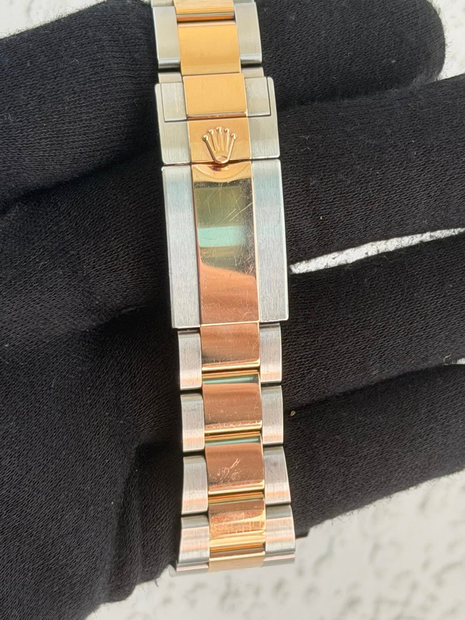 May be an image of wrist watch and jewelry