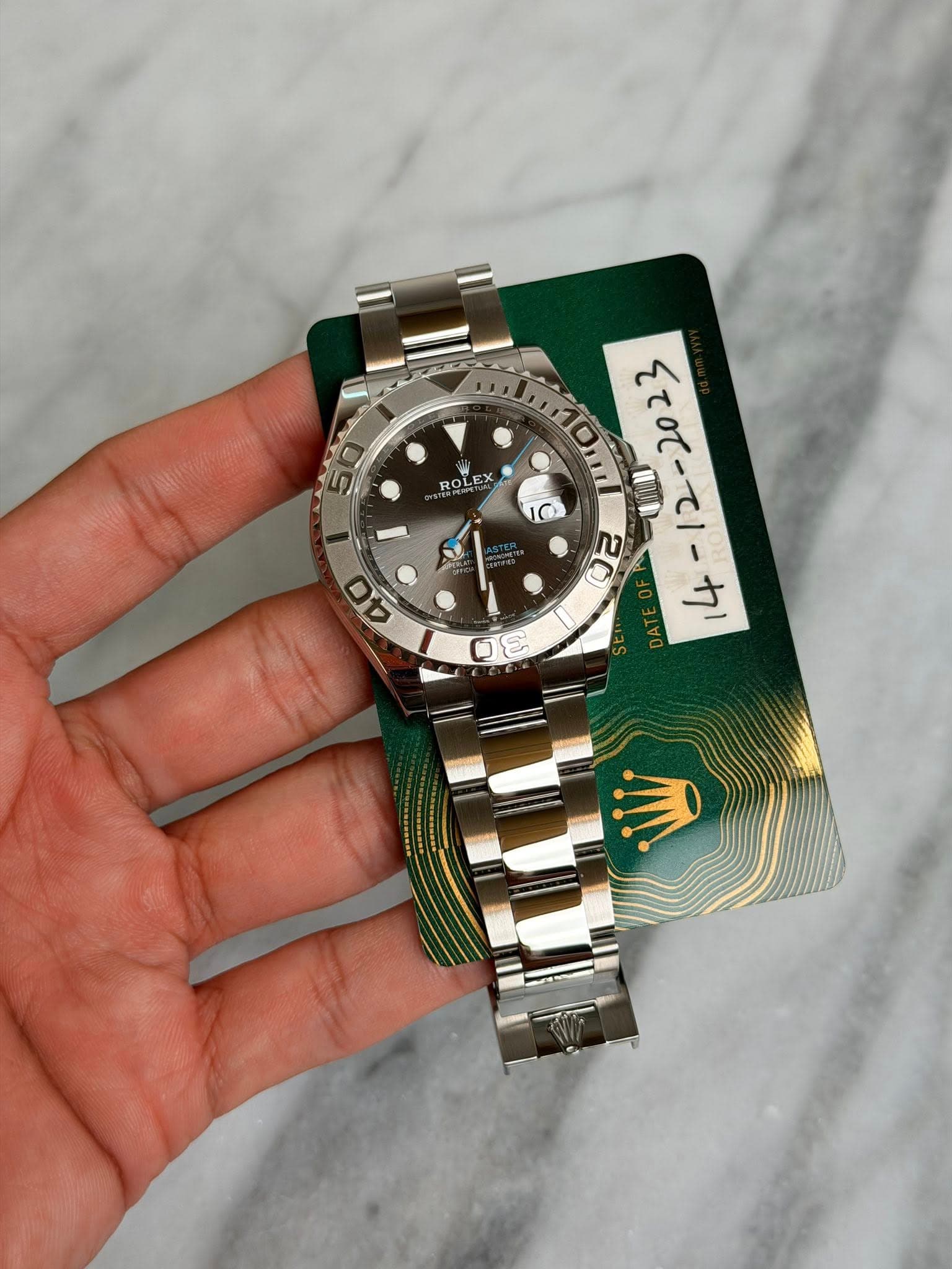 May be an image of wrist watch and text