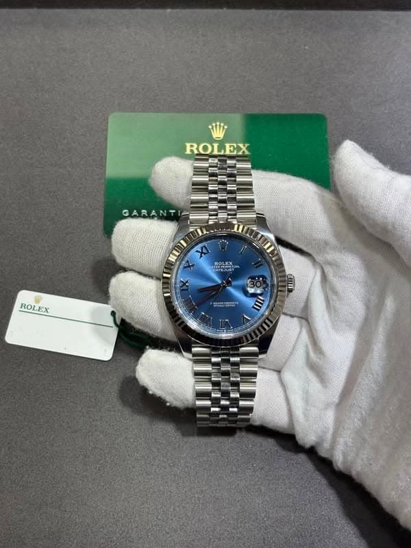 May be an image of wrist watch and text that says 'ROLEX GARANT แบว ROLEX DATESU TEJUBT Tu ROLEX TOM ooH IIII'