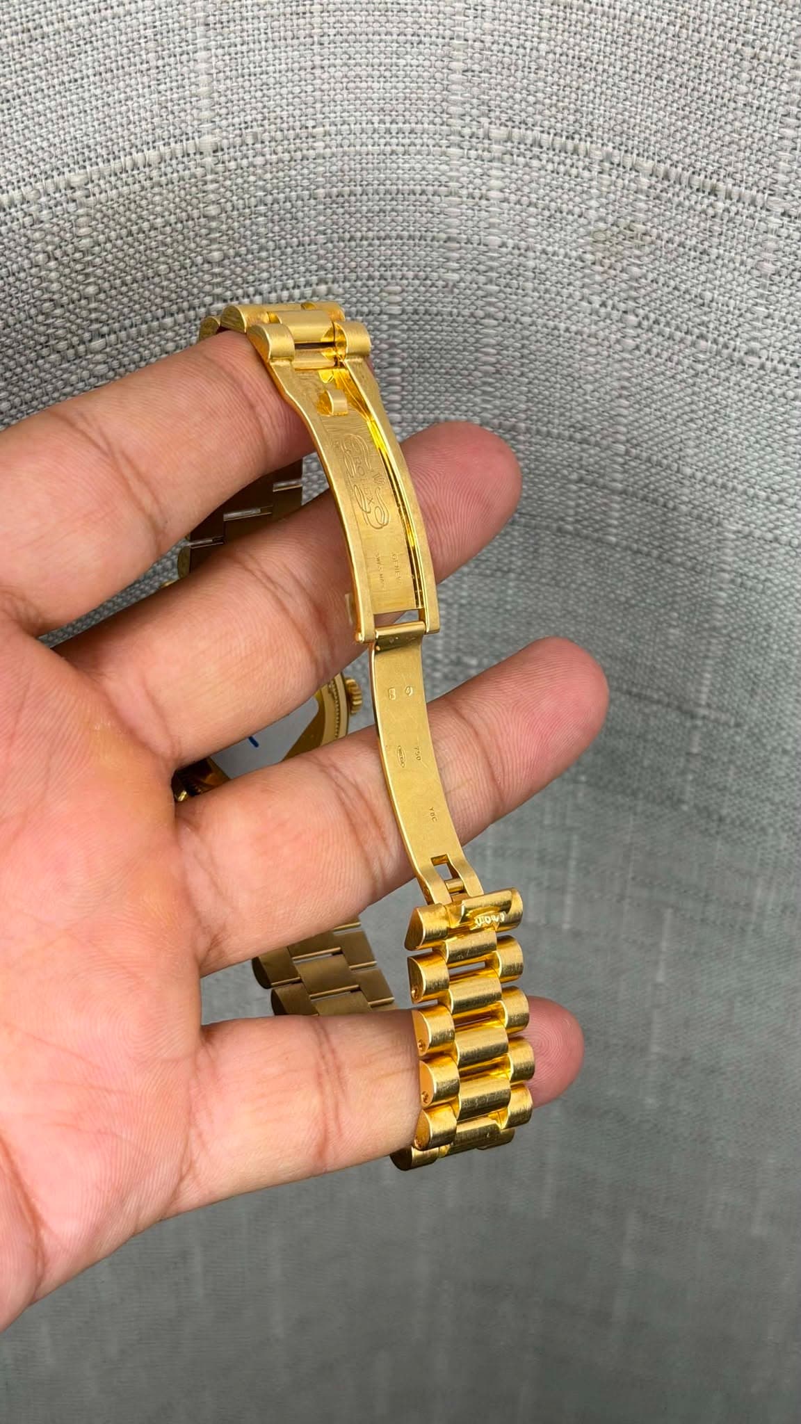 May be an image of wrist watch and text