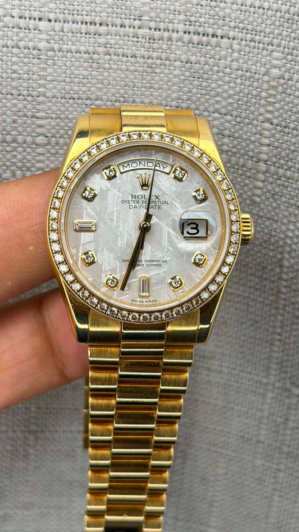 May be an image of wrist watch and text