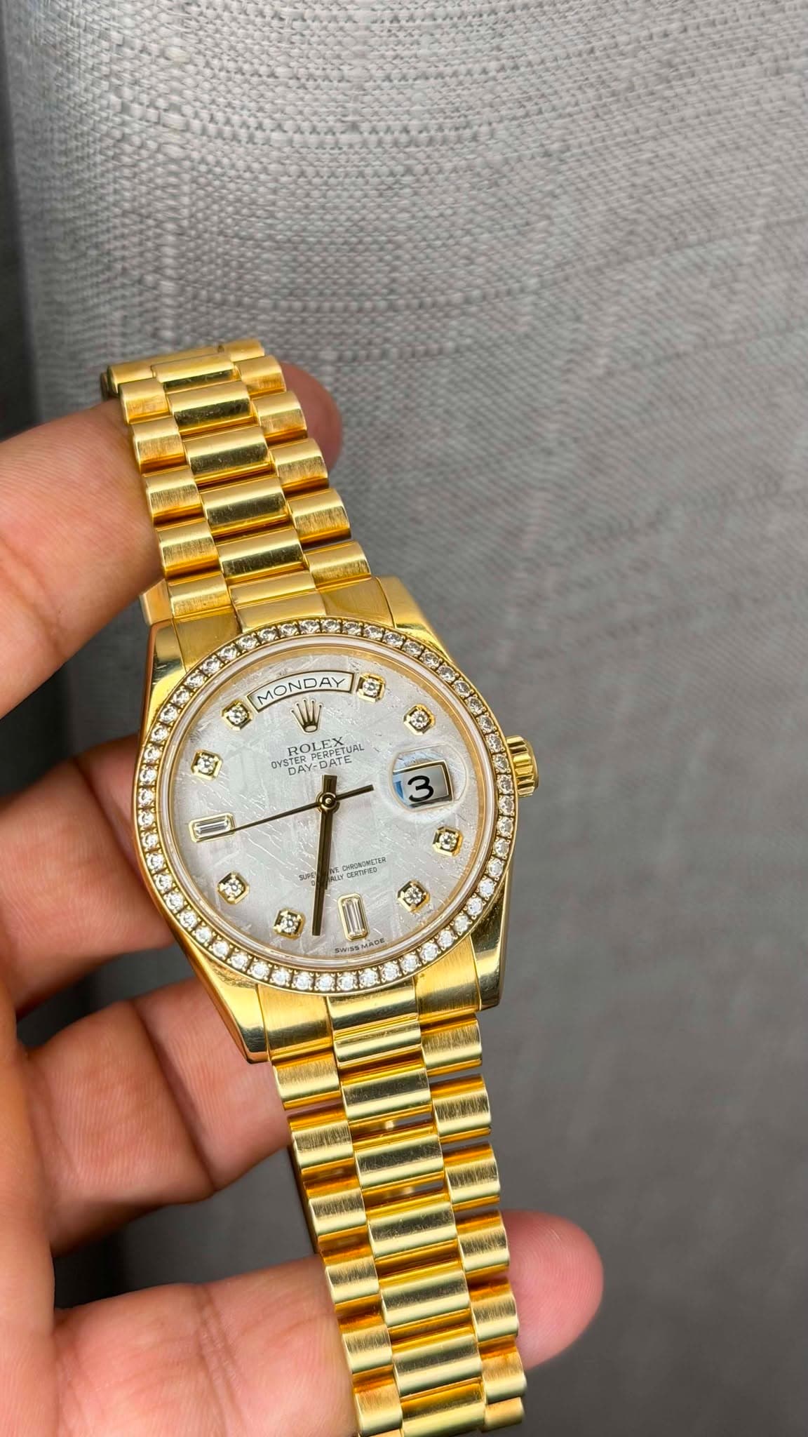 May be an image of wrist watch and text