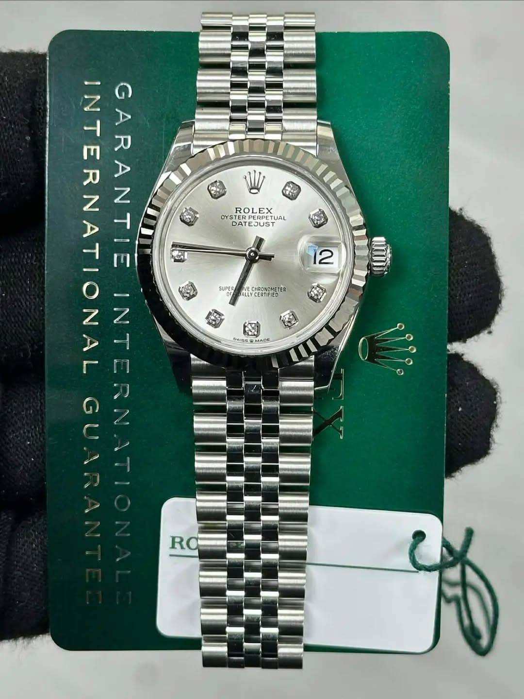 May be an image of wrist watch and text