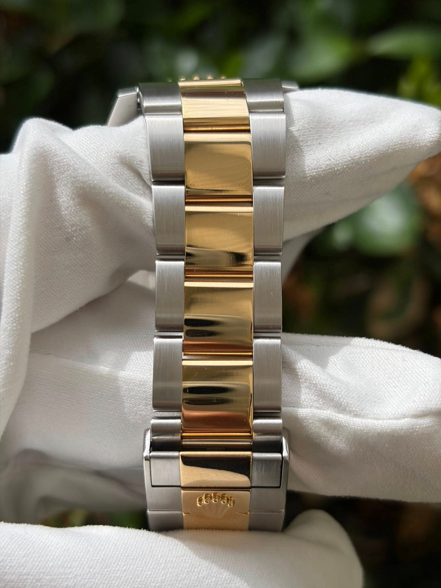 May be an image of wrist watch and text