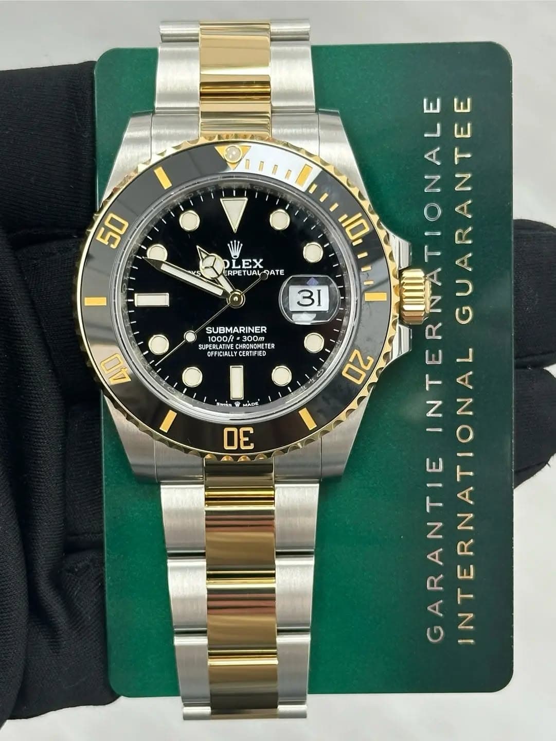 May be an image of wrist watch and text that says '50 S LEX ERPETUAL ETAھ SUBMARINER HDENATME 01300m 1000/t 300m RONOMETI ซ OFFICIALLYCERTIFIED AO แาโใล MADE 30 4A 10 31…