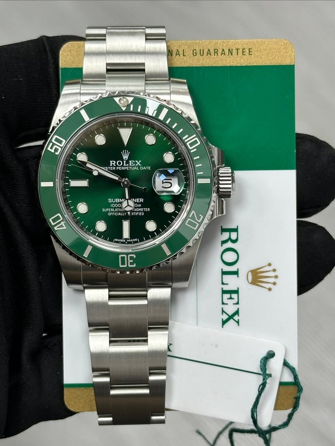 May be an image of wrist watch and text that says 'AL GUARANTEE 50 ROLEX EX ROL STER PERPETUA DATE 10 5 SUBMTINER NER NER SUBM 1000 EBLATI SUPER PERLATIVE NOMETE ETE มนนยา…