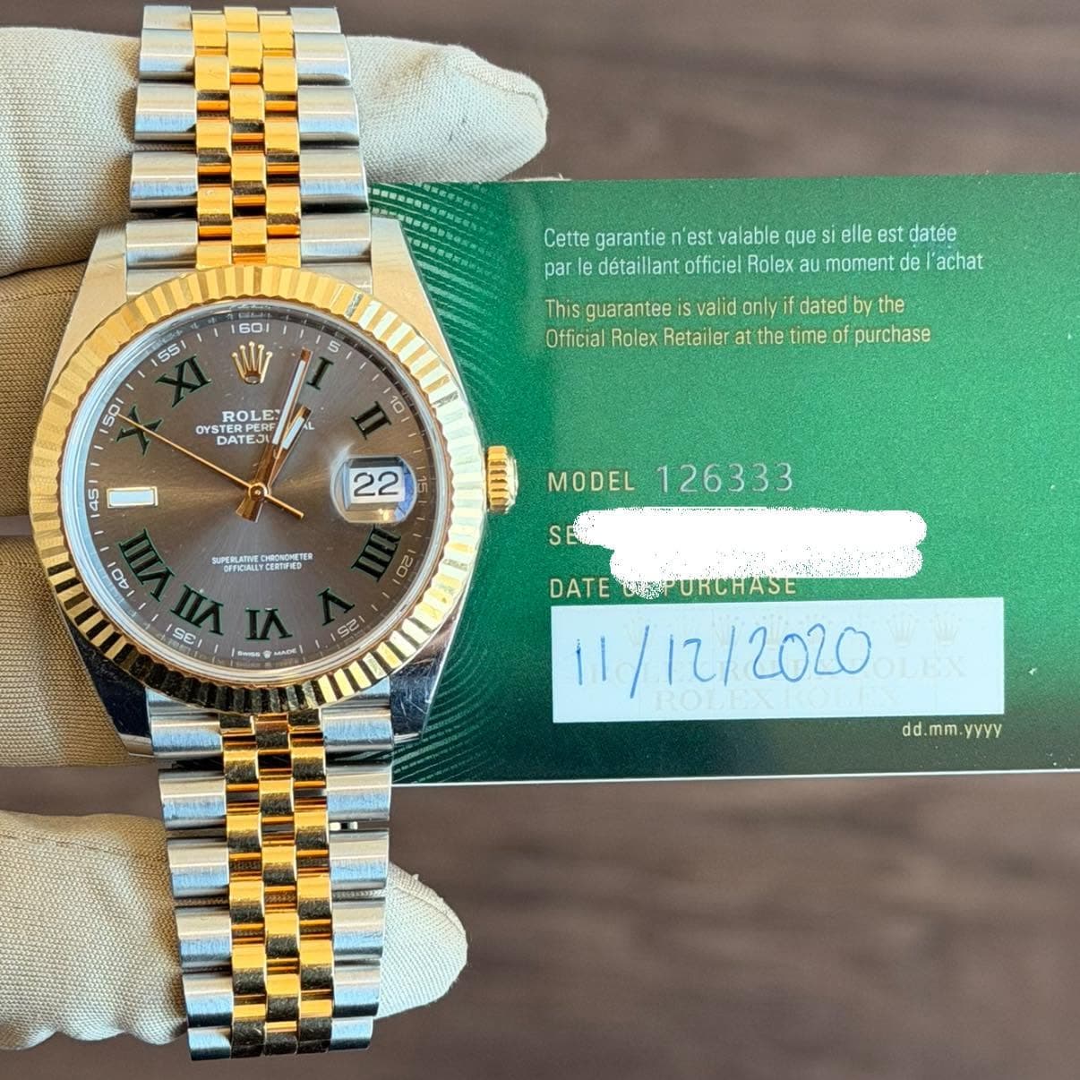 May be an image of wrist watch and text