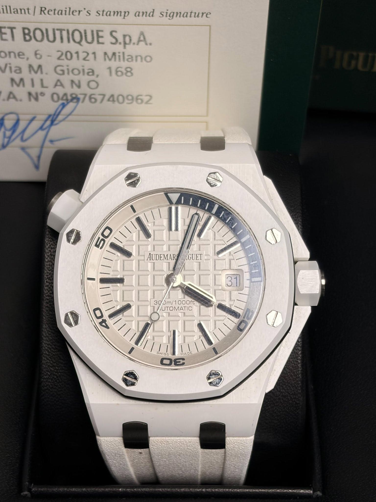 May be an image of wrist watch and text that says 'illant/ Retailer's stamp and signature ET BOUTIQUE S.p.A. one, 20121 Milano /ia M. Gioia, 168 M MILANO .A. N° AUDEMAR GUET 10…