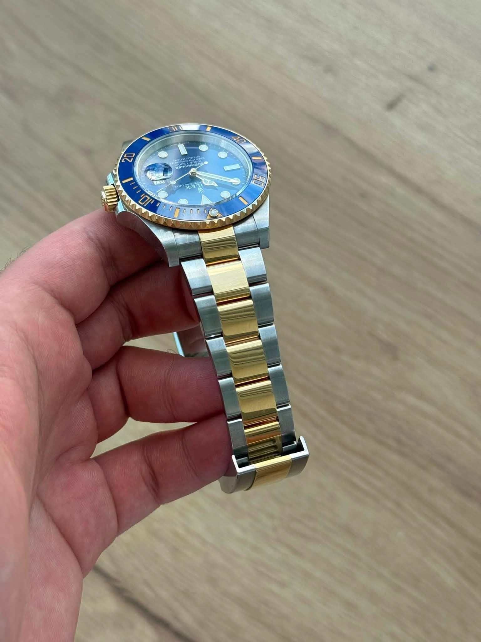 May be an image of wrist watch and text