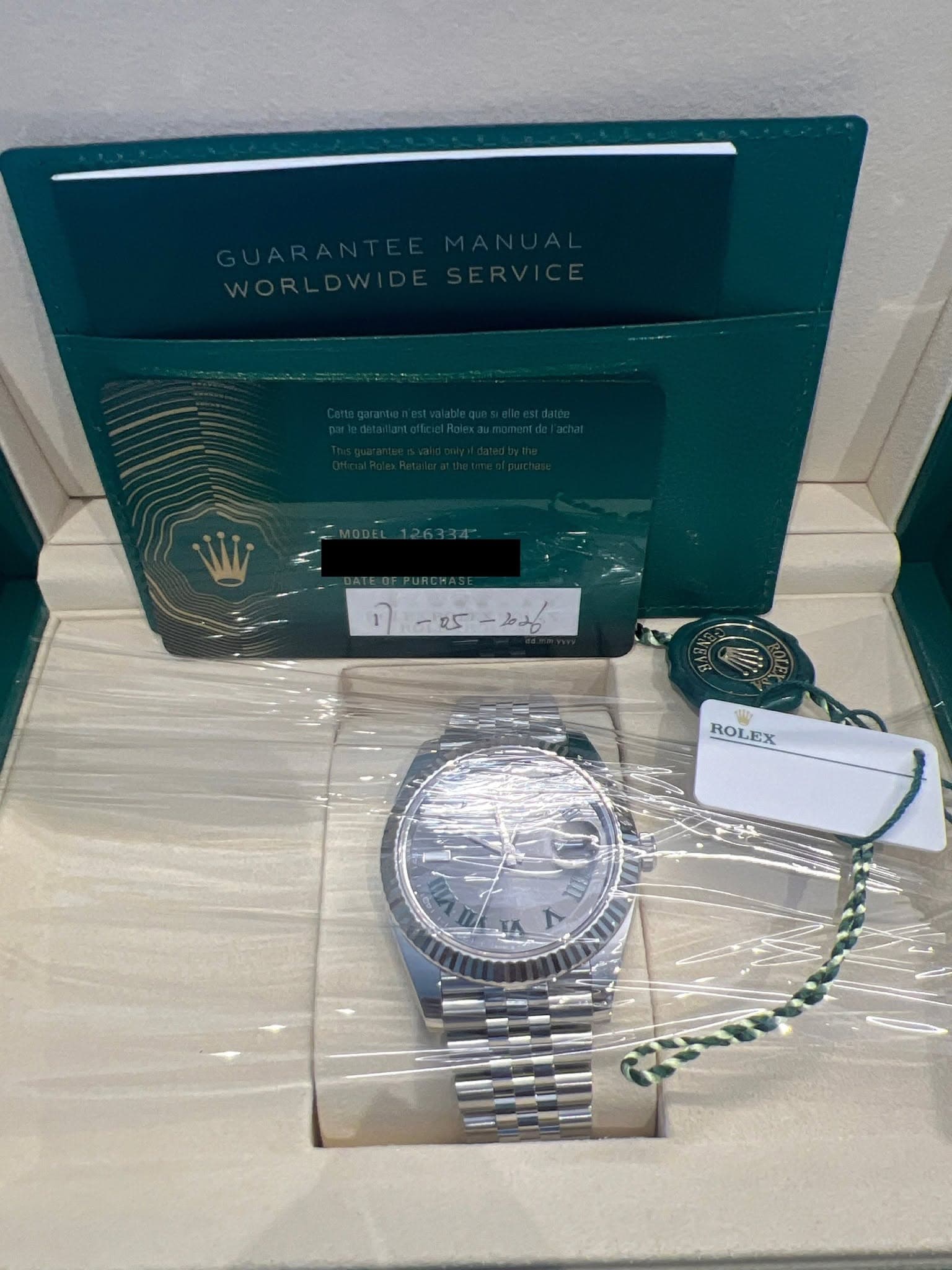 May be an image of wrist watch and text that says '1-25-๒ม -25 -202 ก ROLEX EX U ٢'