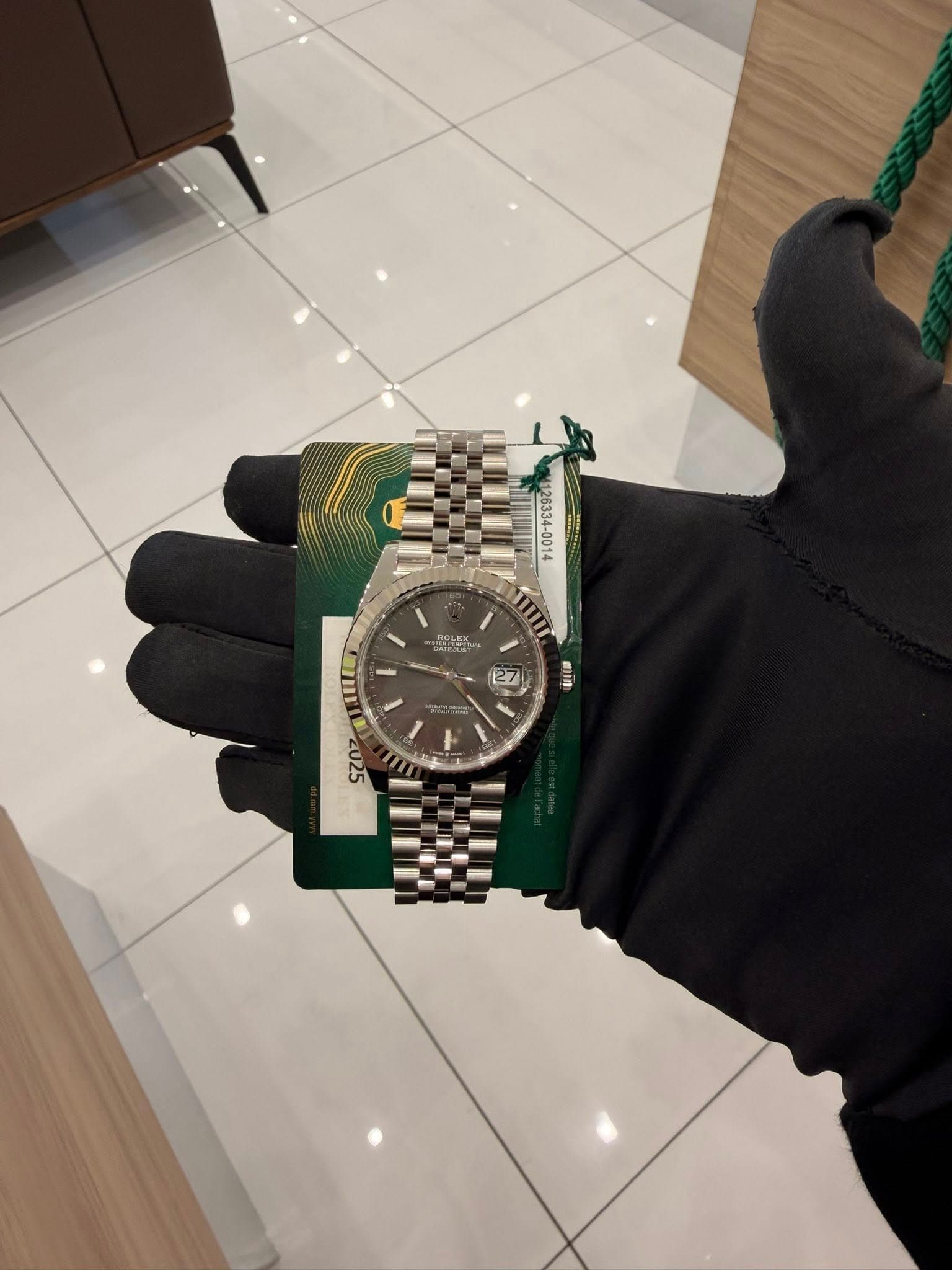 May be an image of wrist watch and text