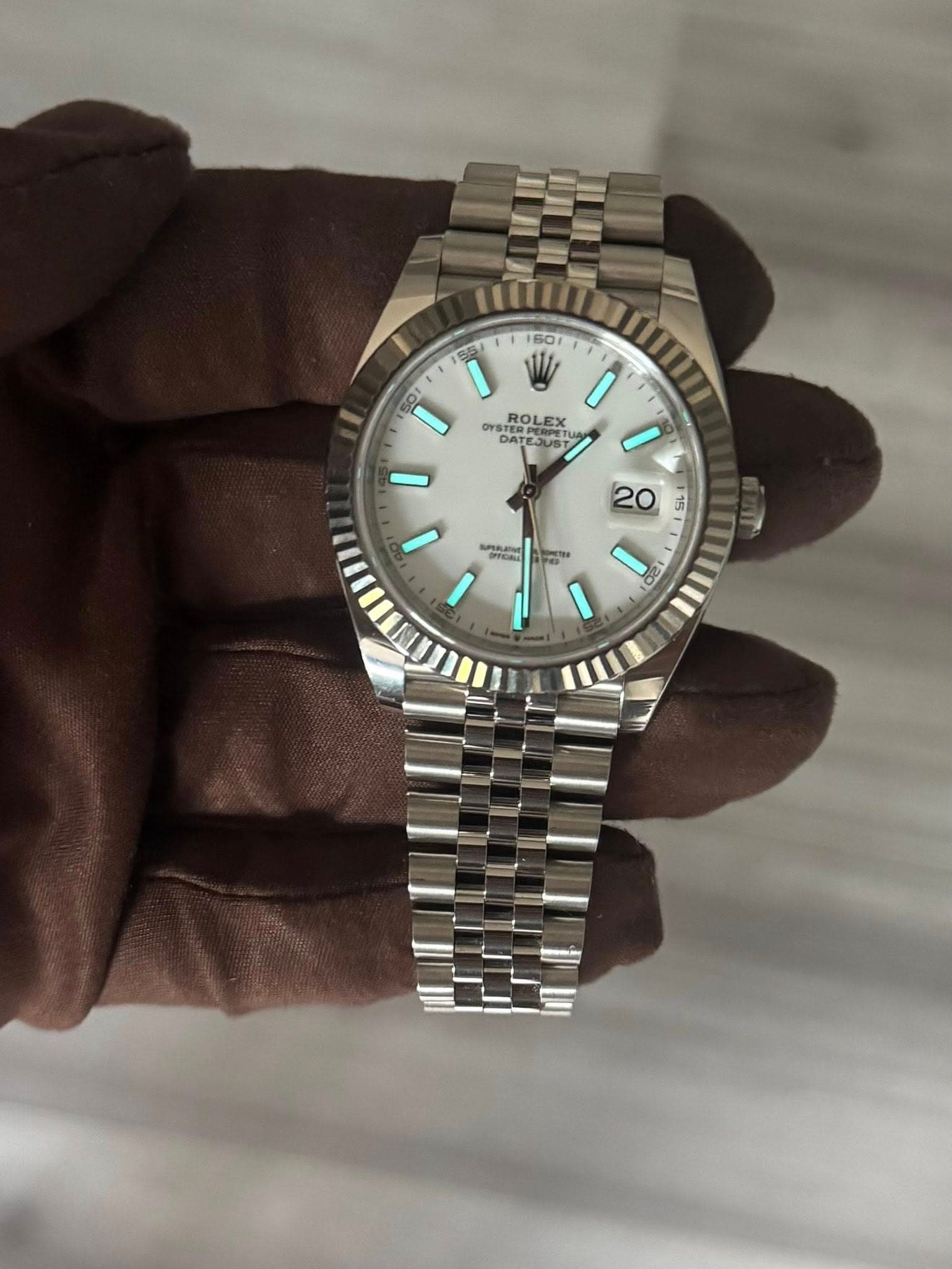 May be an image of wrist watch and text