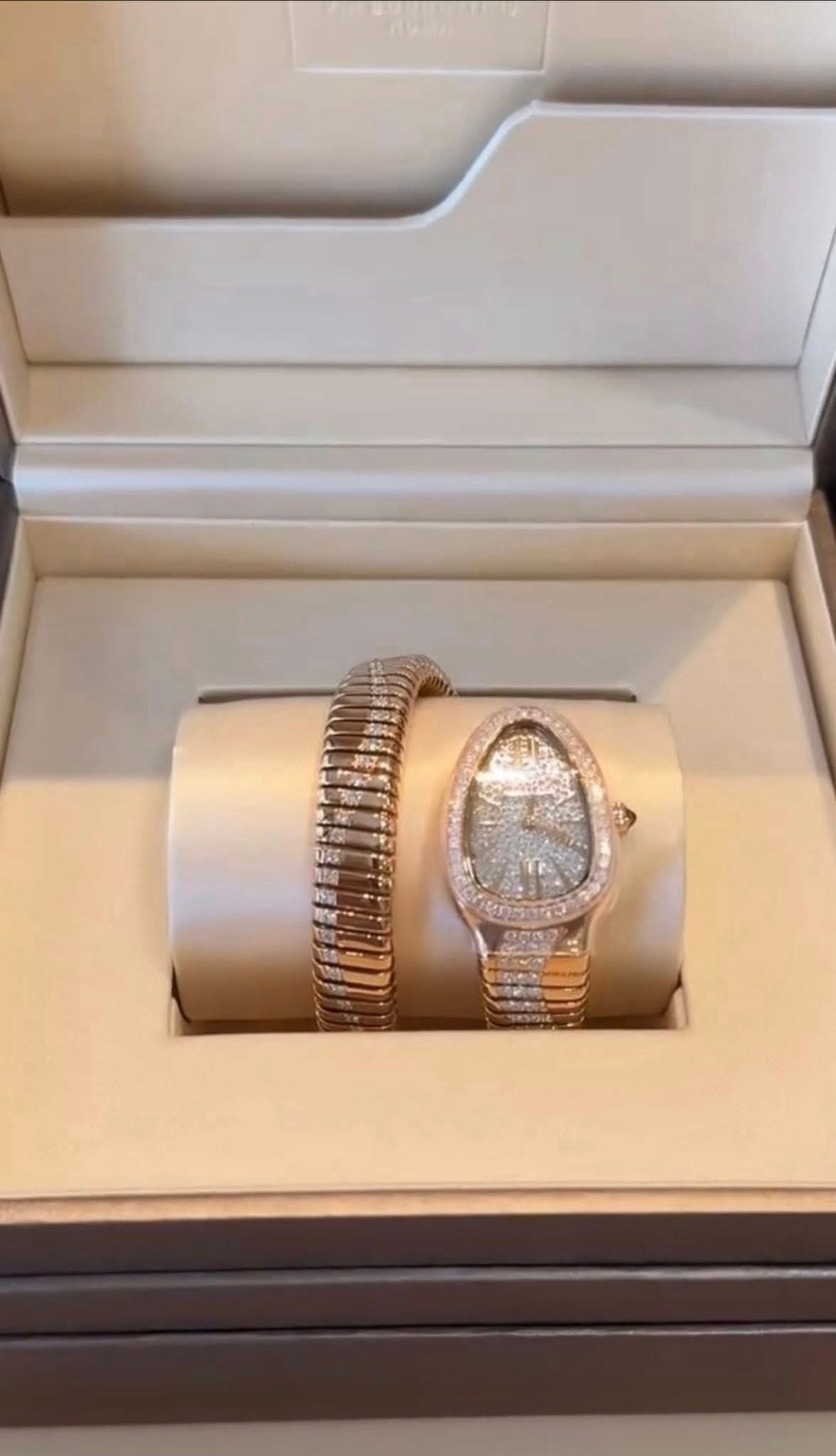May be an image of jewelry, wrist watch and text