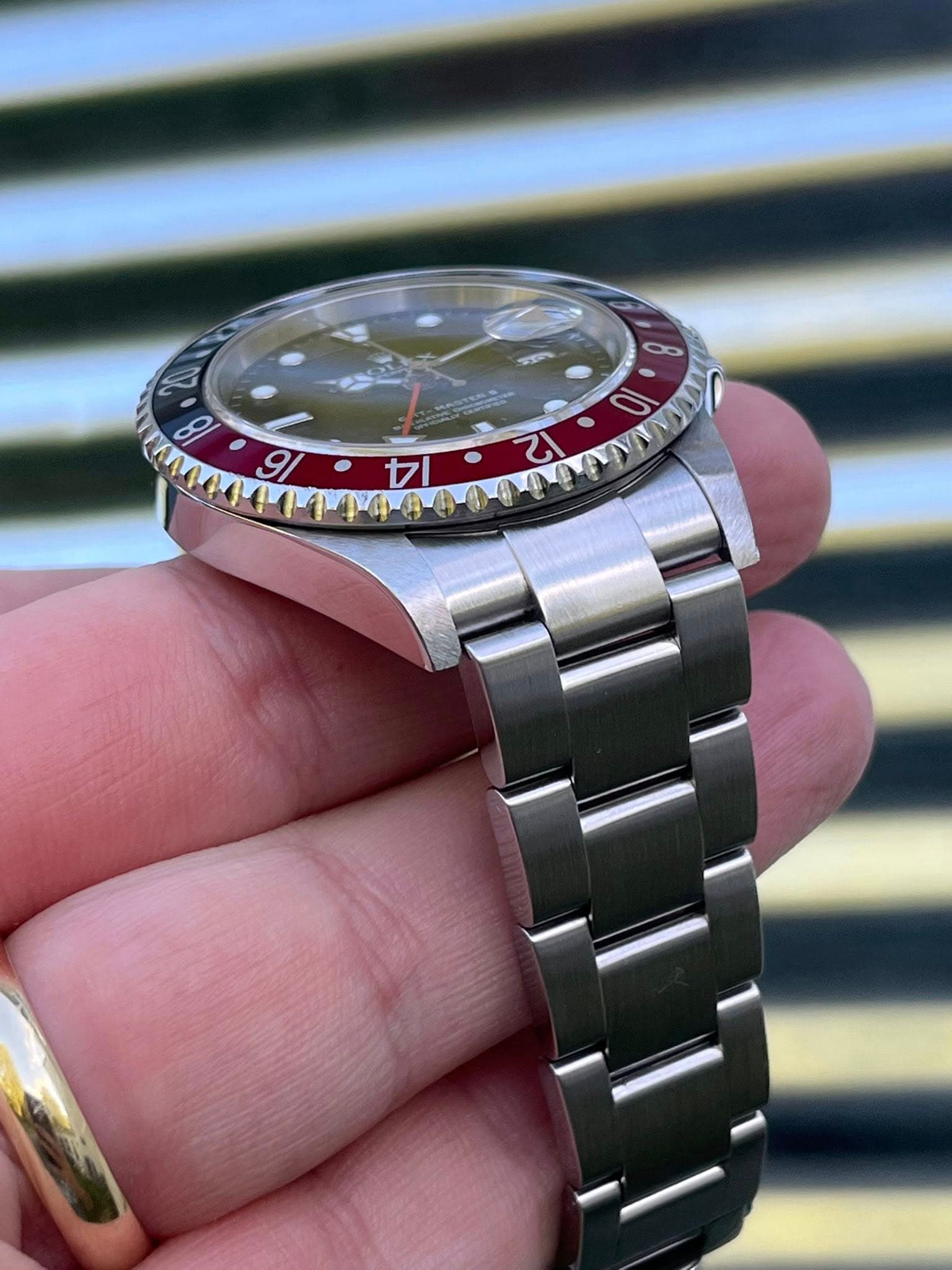 May be an image of wrist watch and text