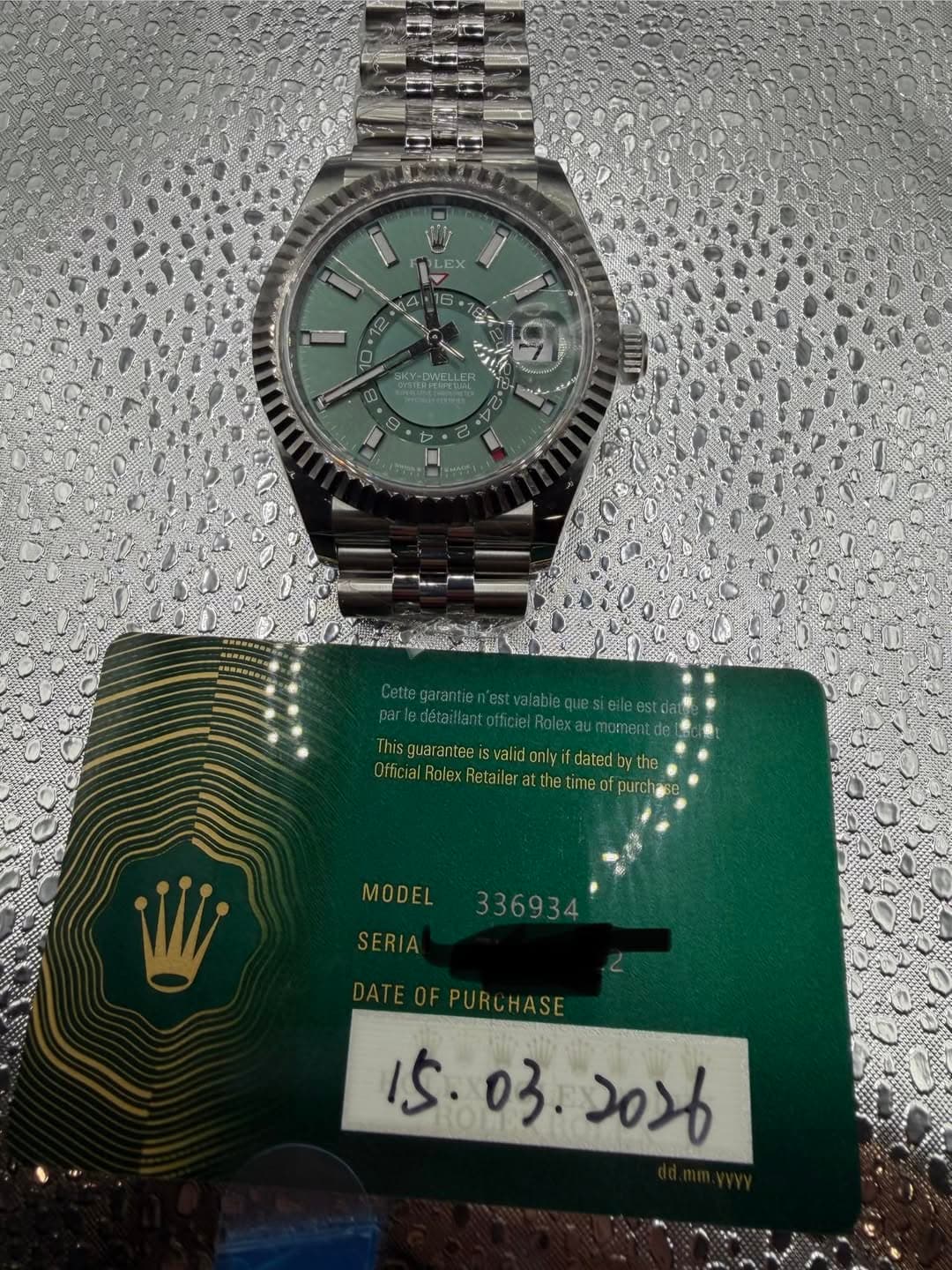 May be an image of wrist watch and text