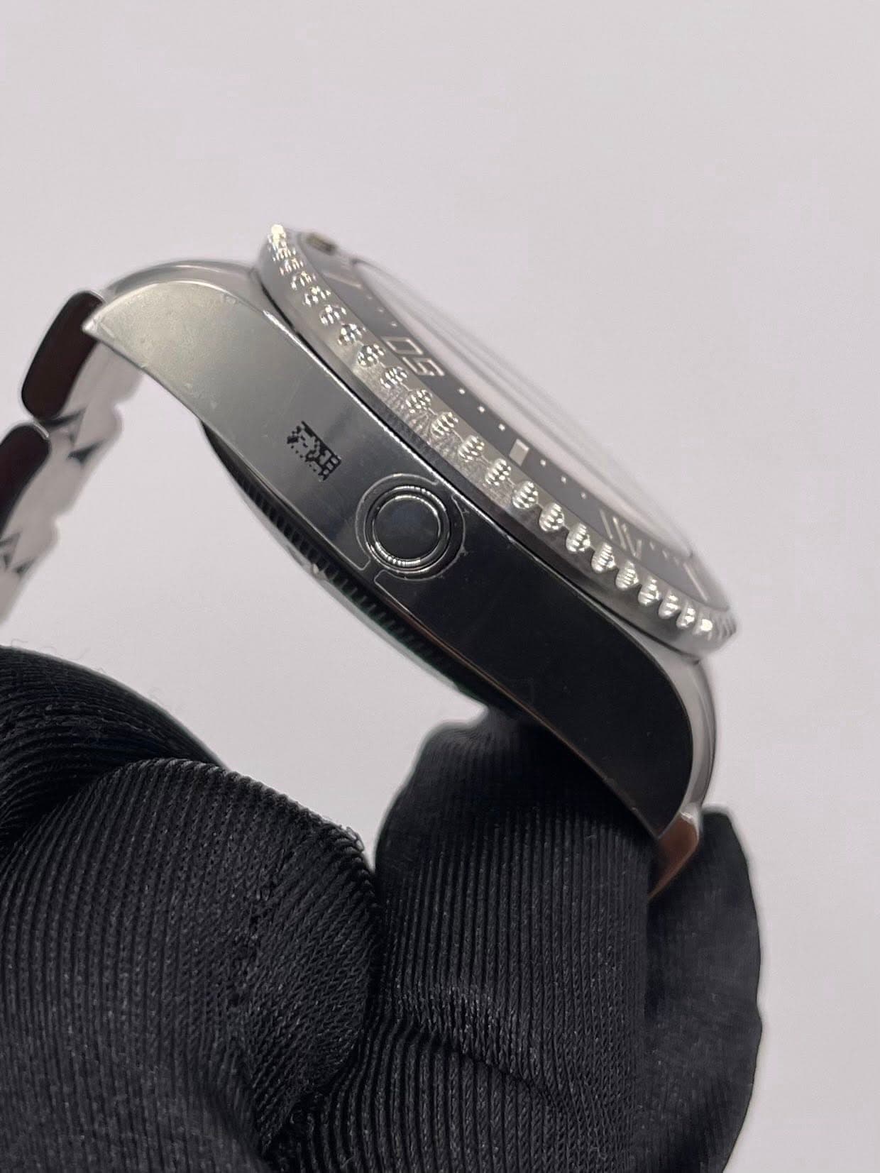 May be an image of wrist watch and text