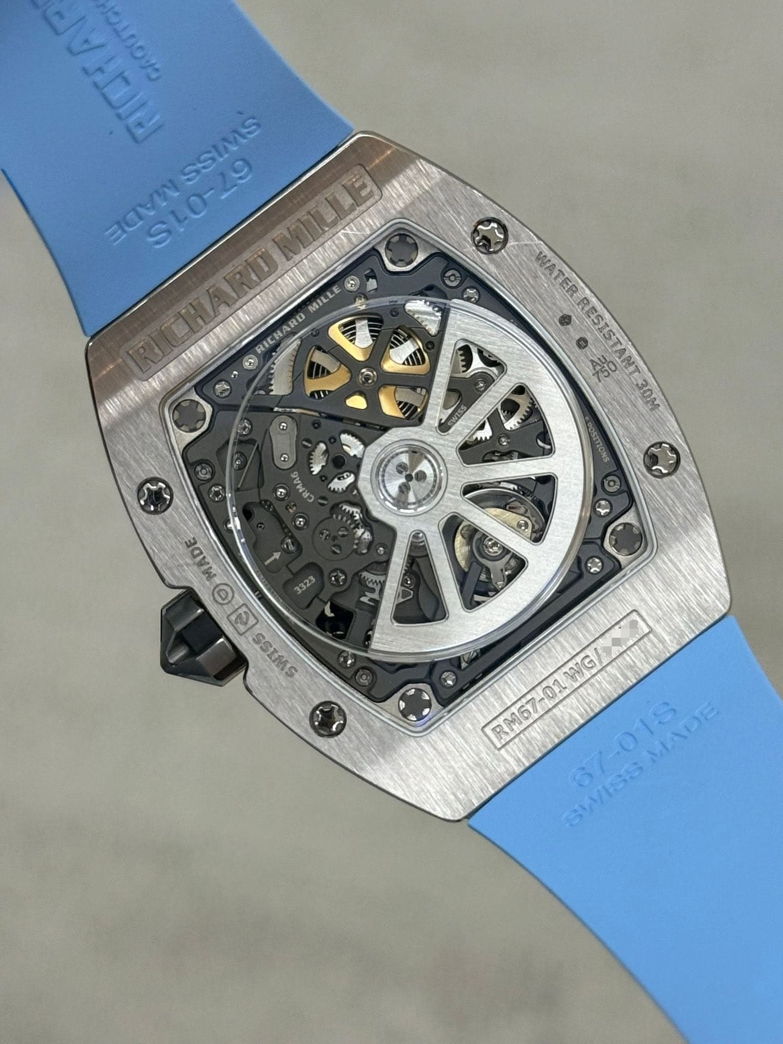 May be an image of wrist watch and text