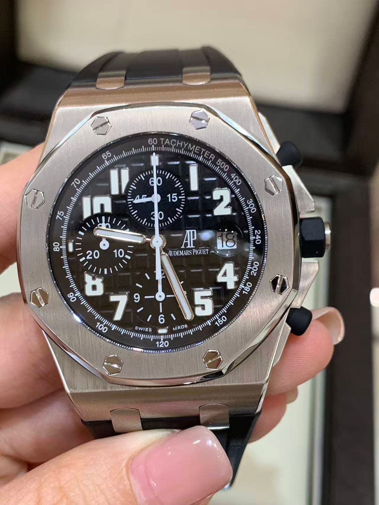 May be an image of wrist watch and text